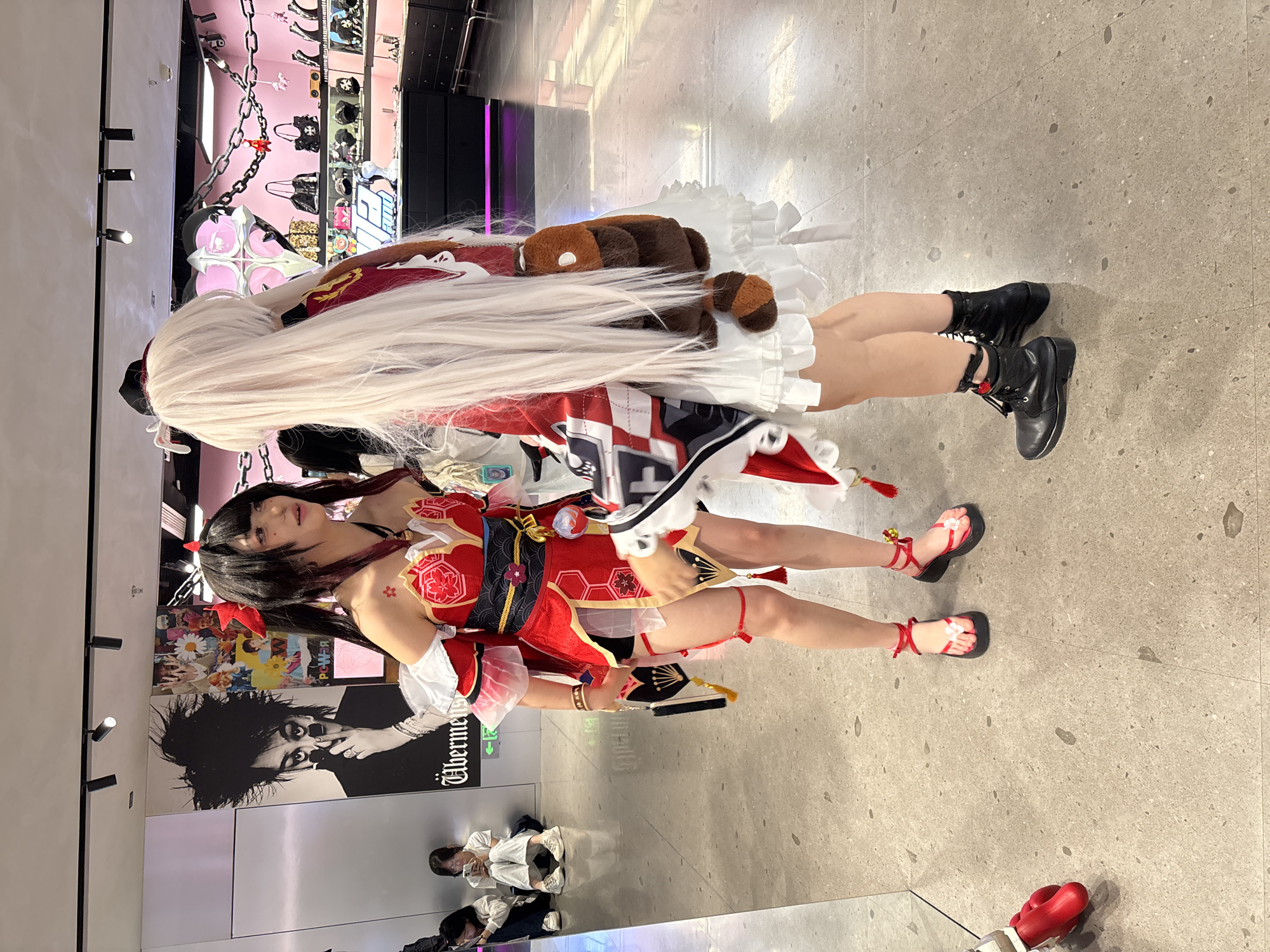 Cosplayers gather in early morning urban commercial district