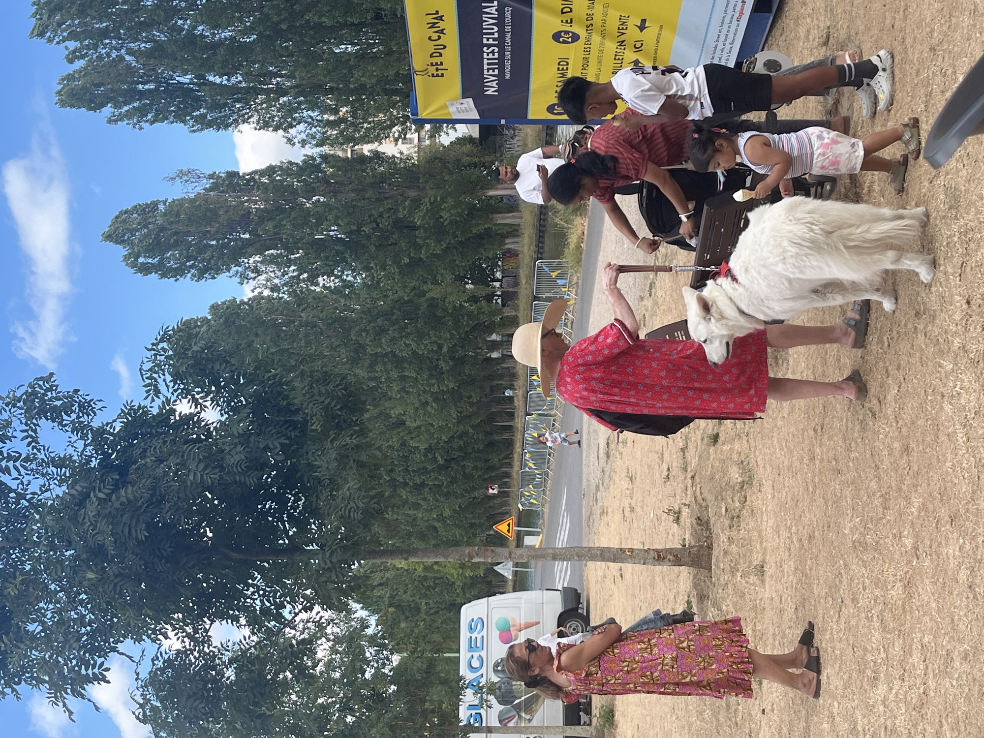 Community festival in Bobigny with giant pink elephant and canal activity