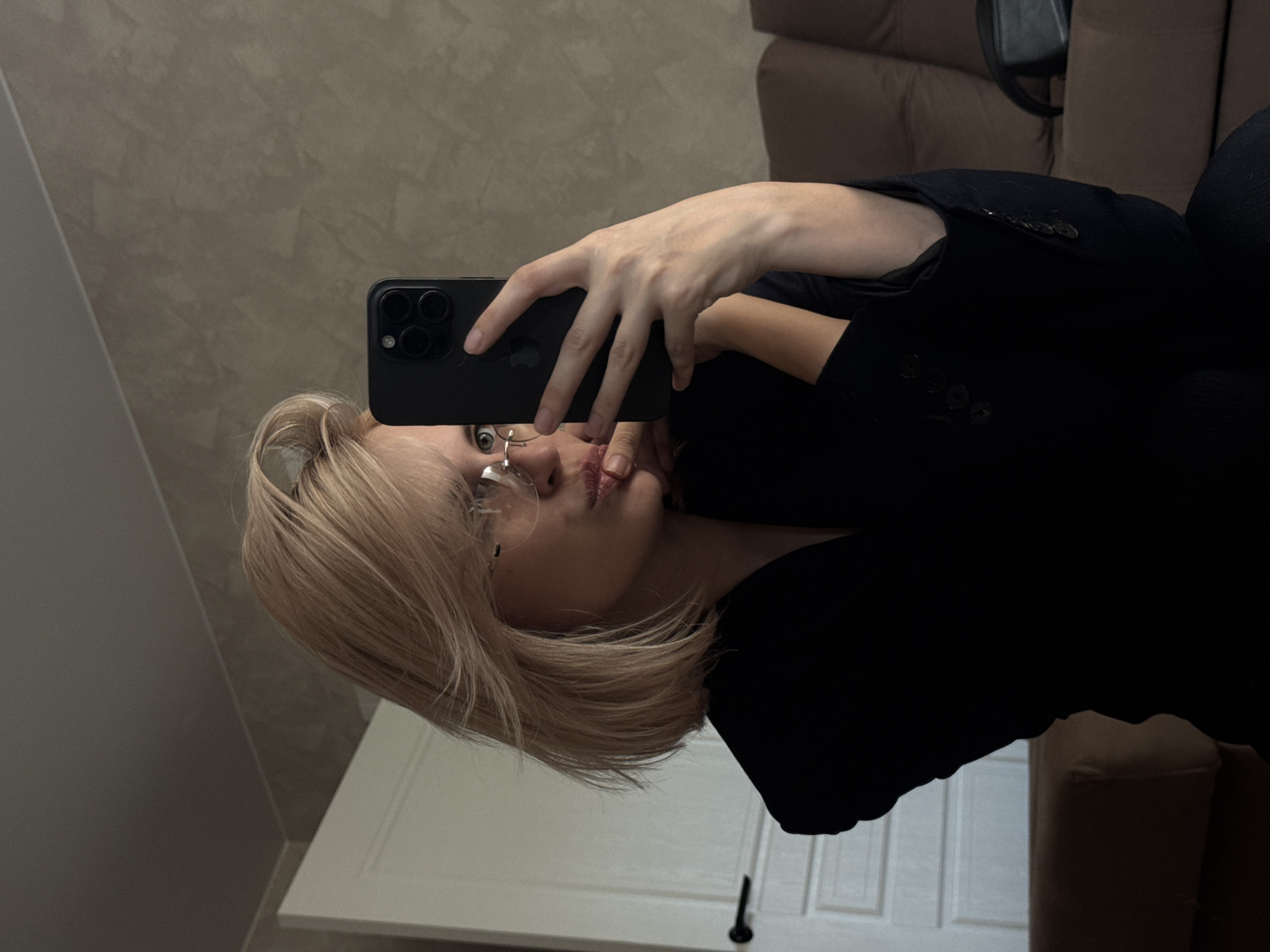 Woman takes mirror selfies in Saratov apartment