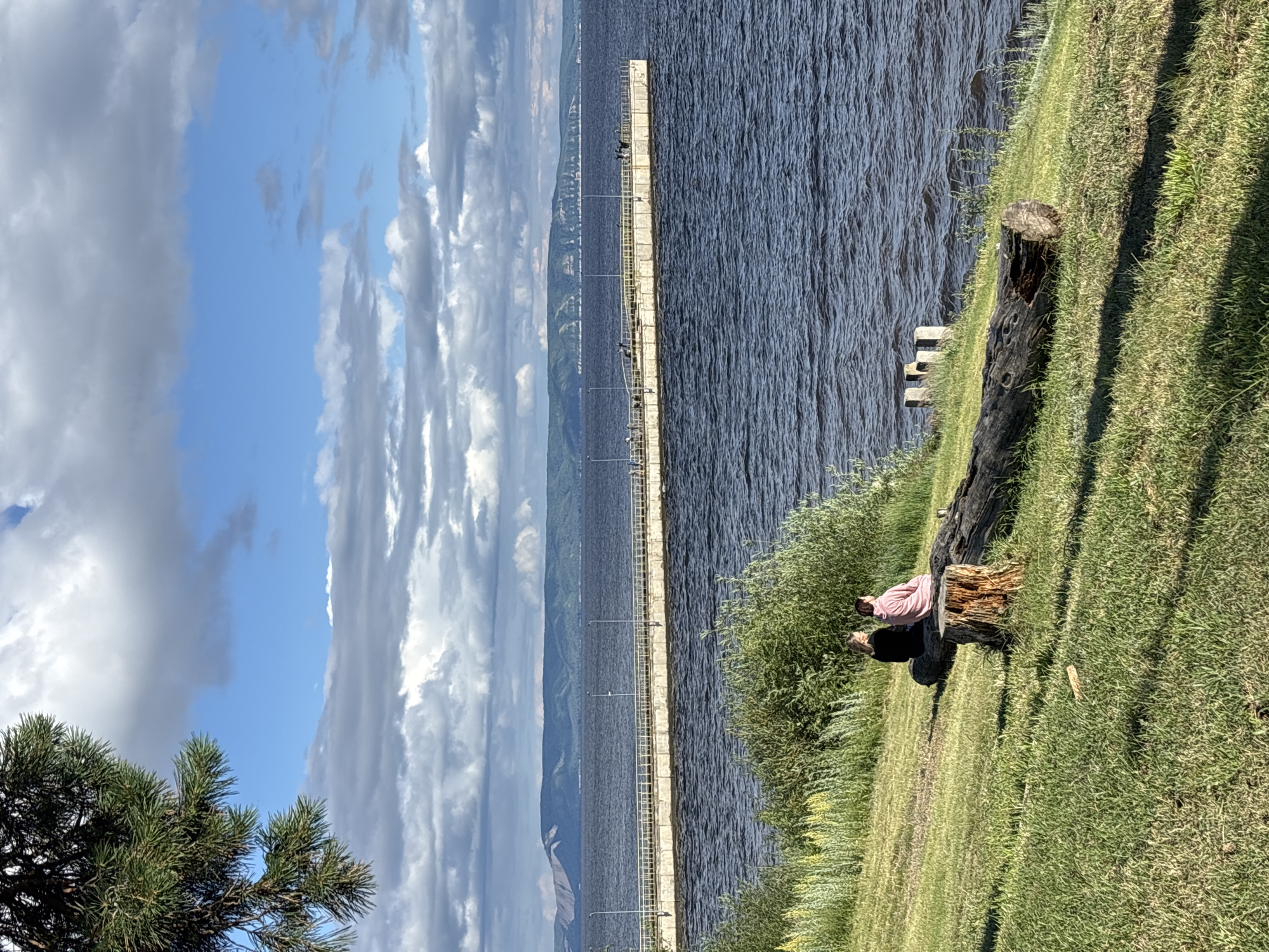 Quiet afternoon along a riverside walkway in Podstepki