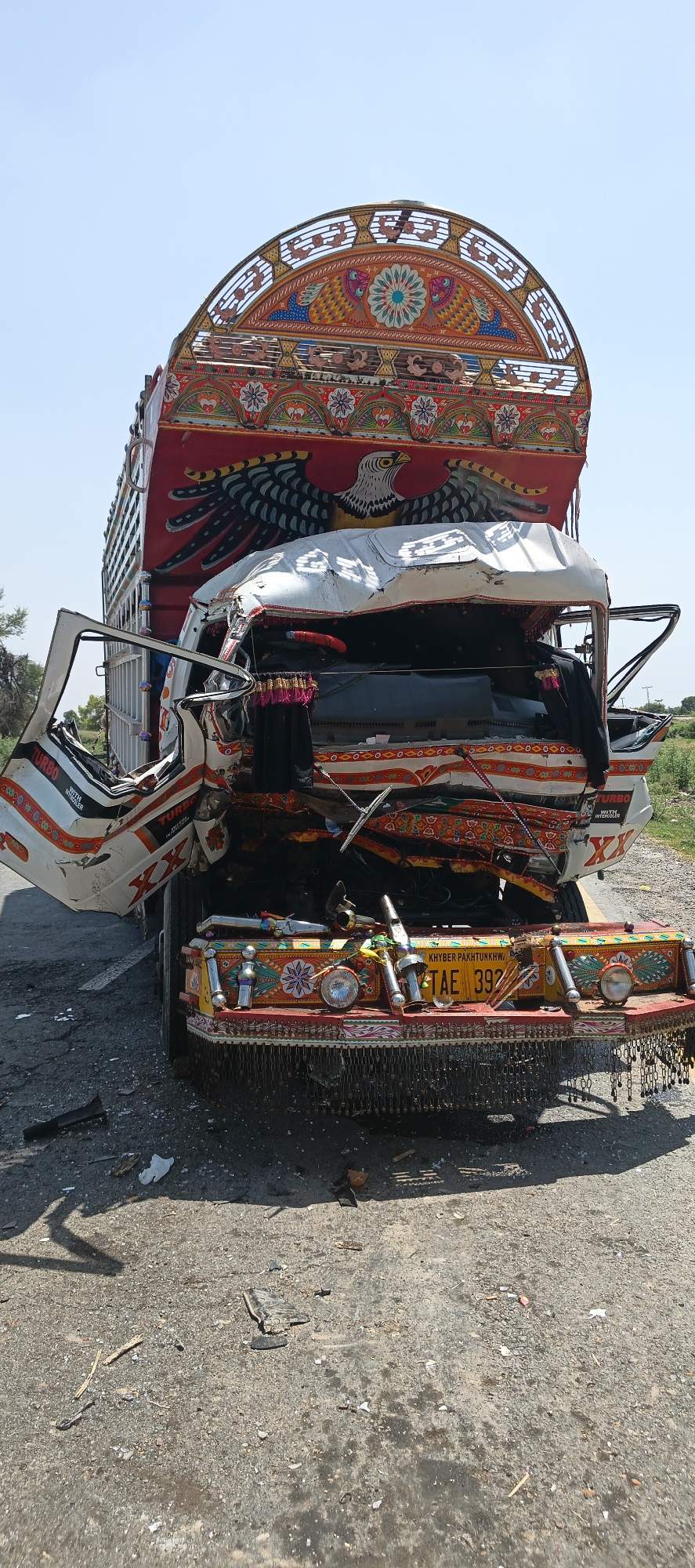 Decorated truck severely damaged in collision near Mandihar, Pakistan