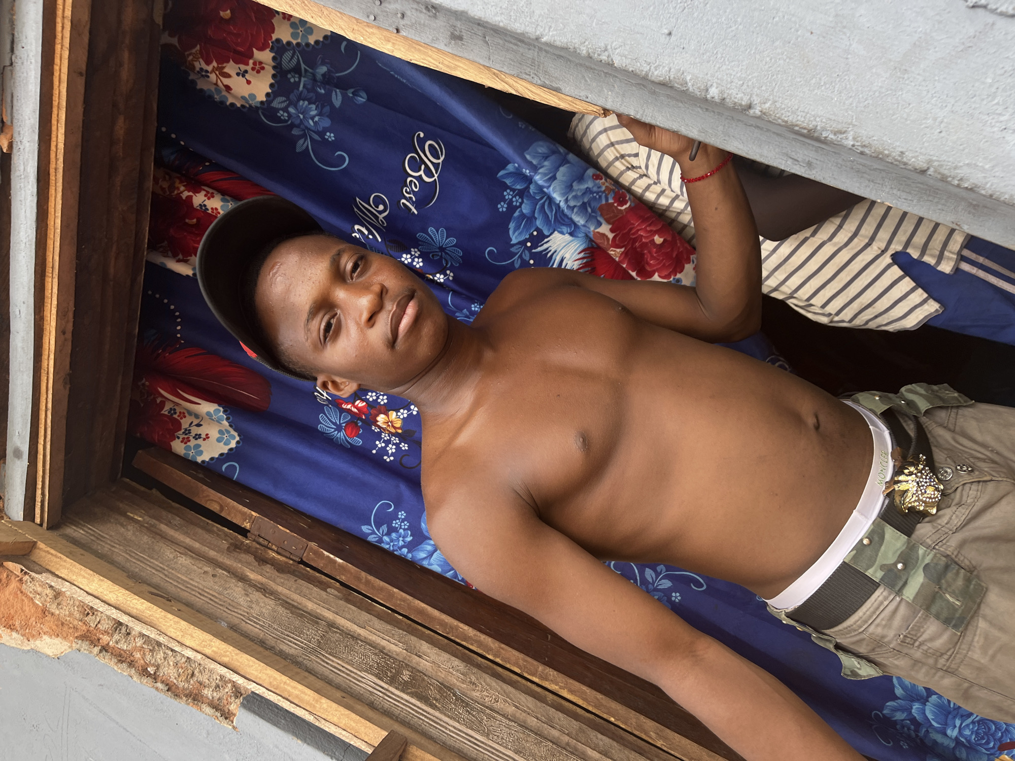 Young man photographed with Toyota vehicle in Idah, Nigeria