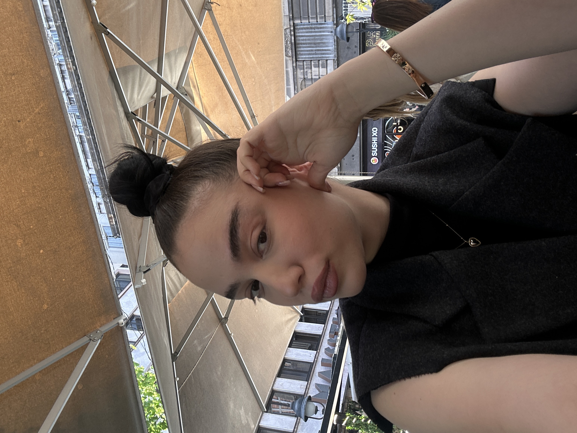Woman dines at outdoor cafe in Belgrade Serbia