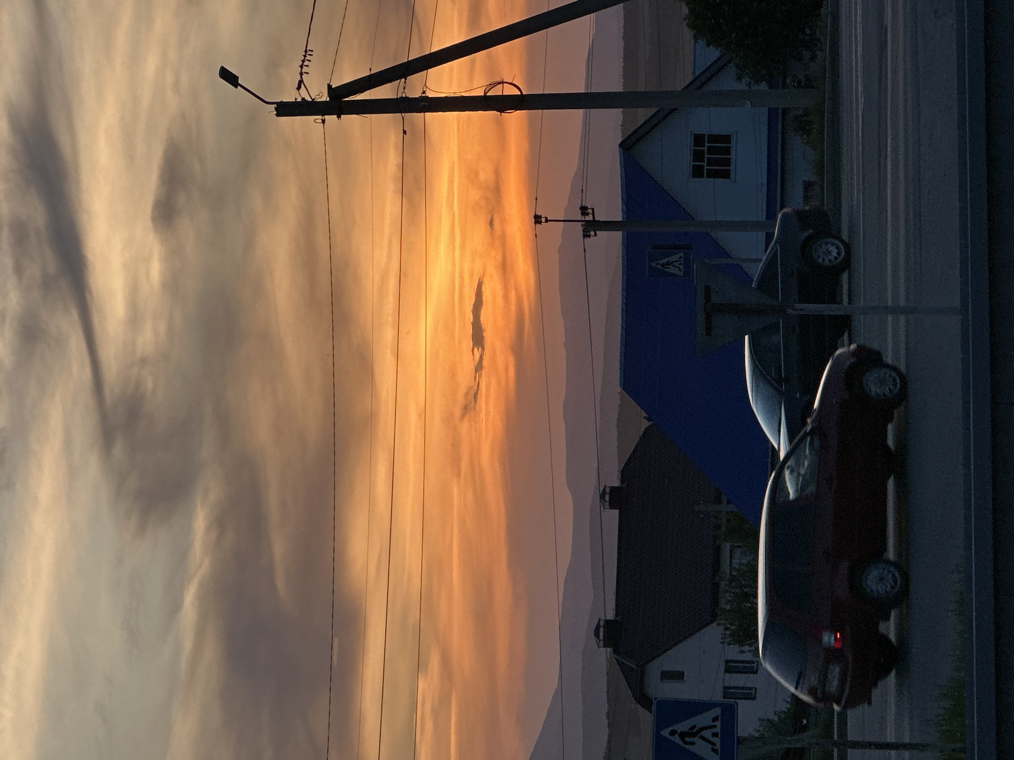 Sunset street scenes with vehicles captured across residential area