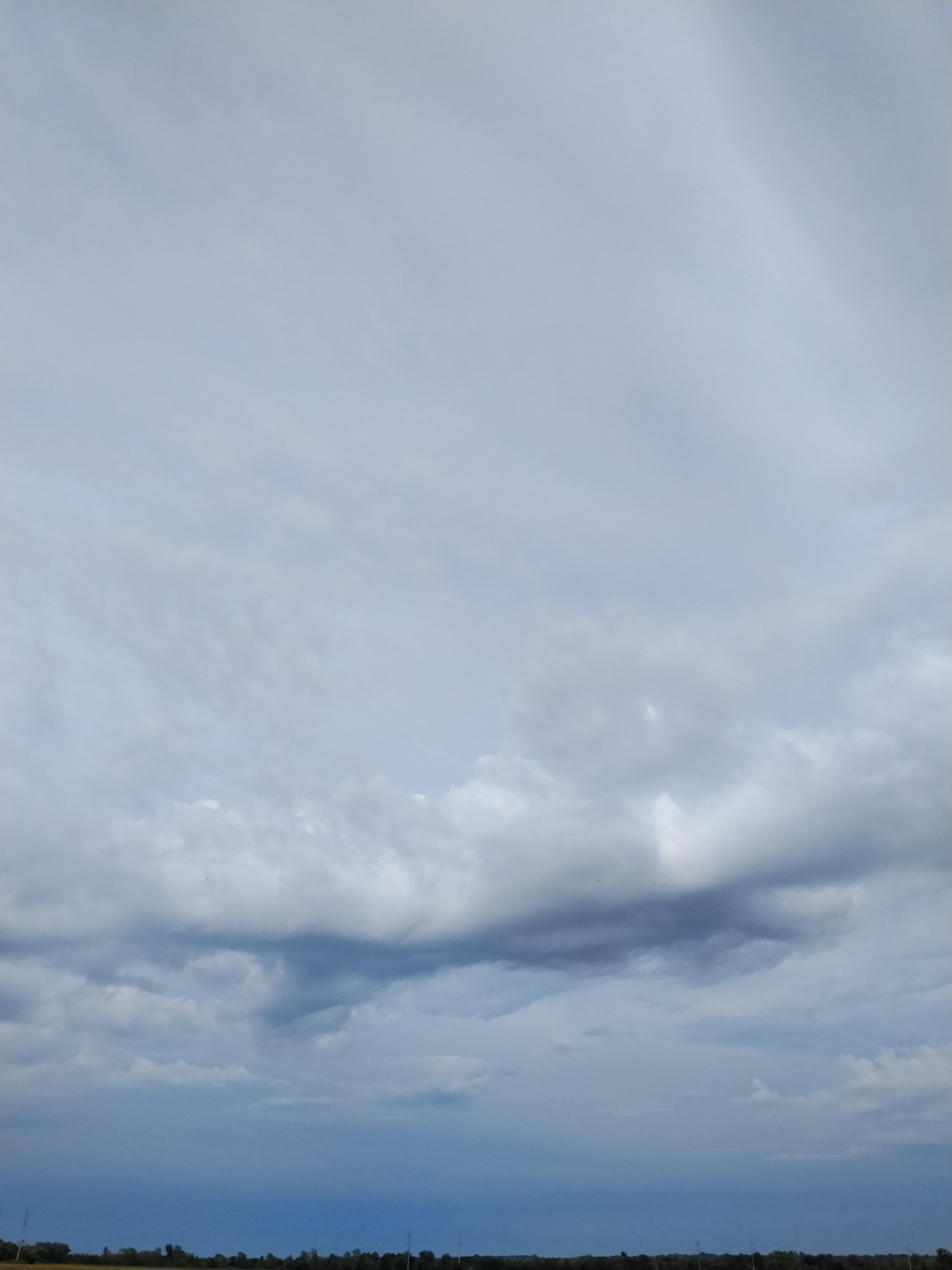 Summer skies and open fields in rural Ustyvytsya, Ukraine