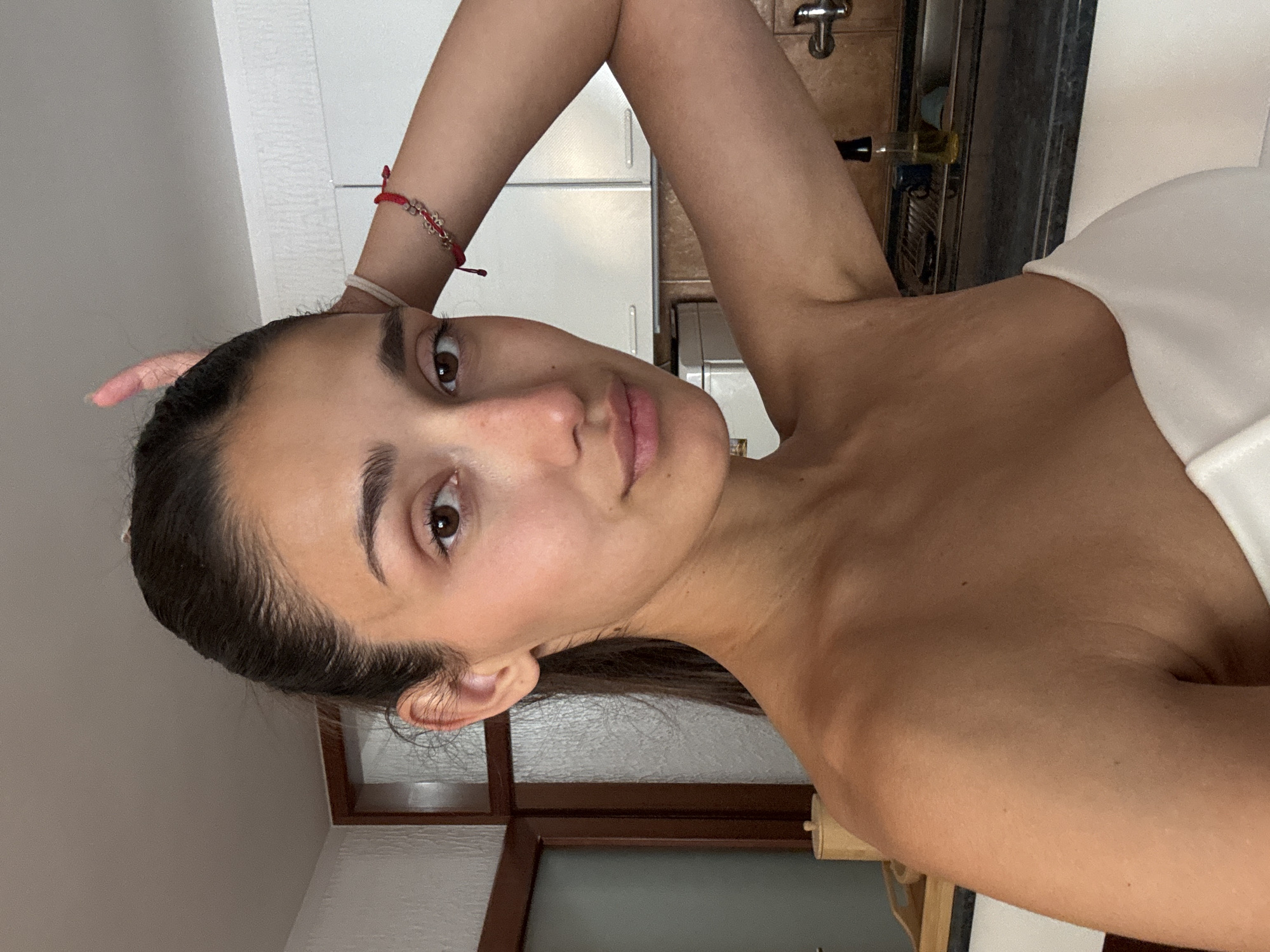 Woman takes kitchen selfie in Montenegro coastal town