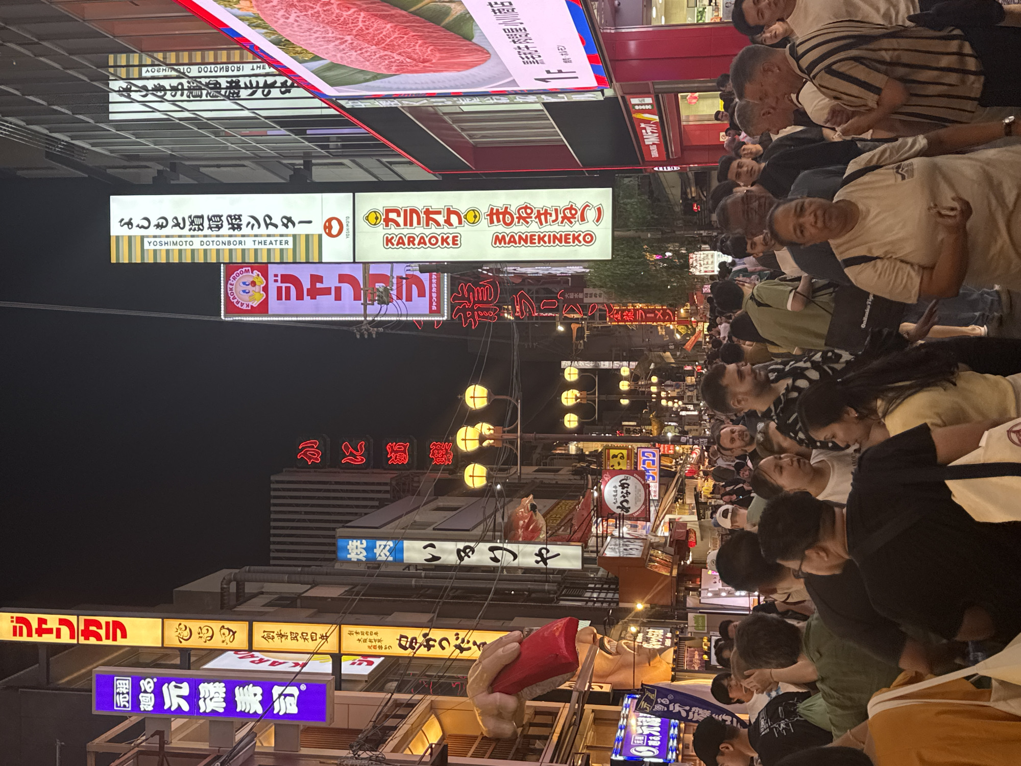 Busy nighttime scenes documented in Osaka entertainment districts