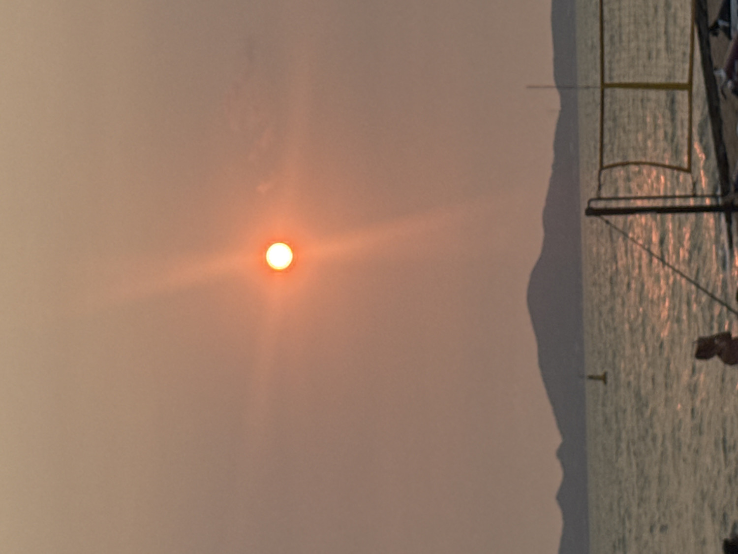 Beach volleyball game observed during sunrise in Pattaya