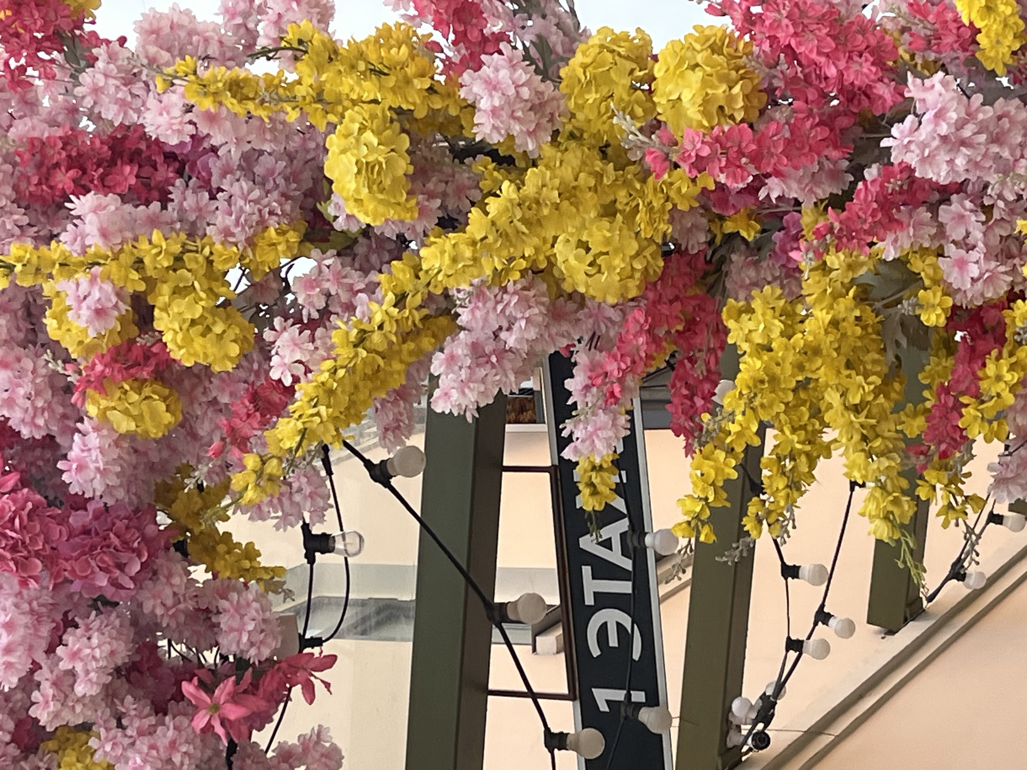 Decorative flower archway installed at building entrance in Izhevsk