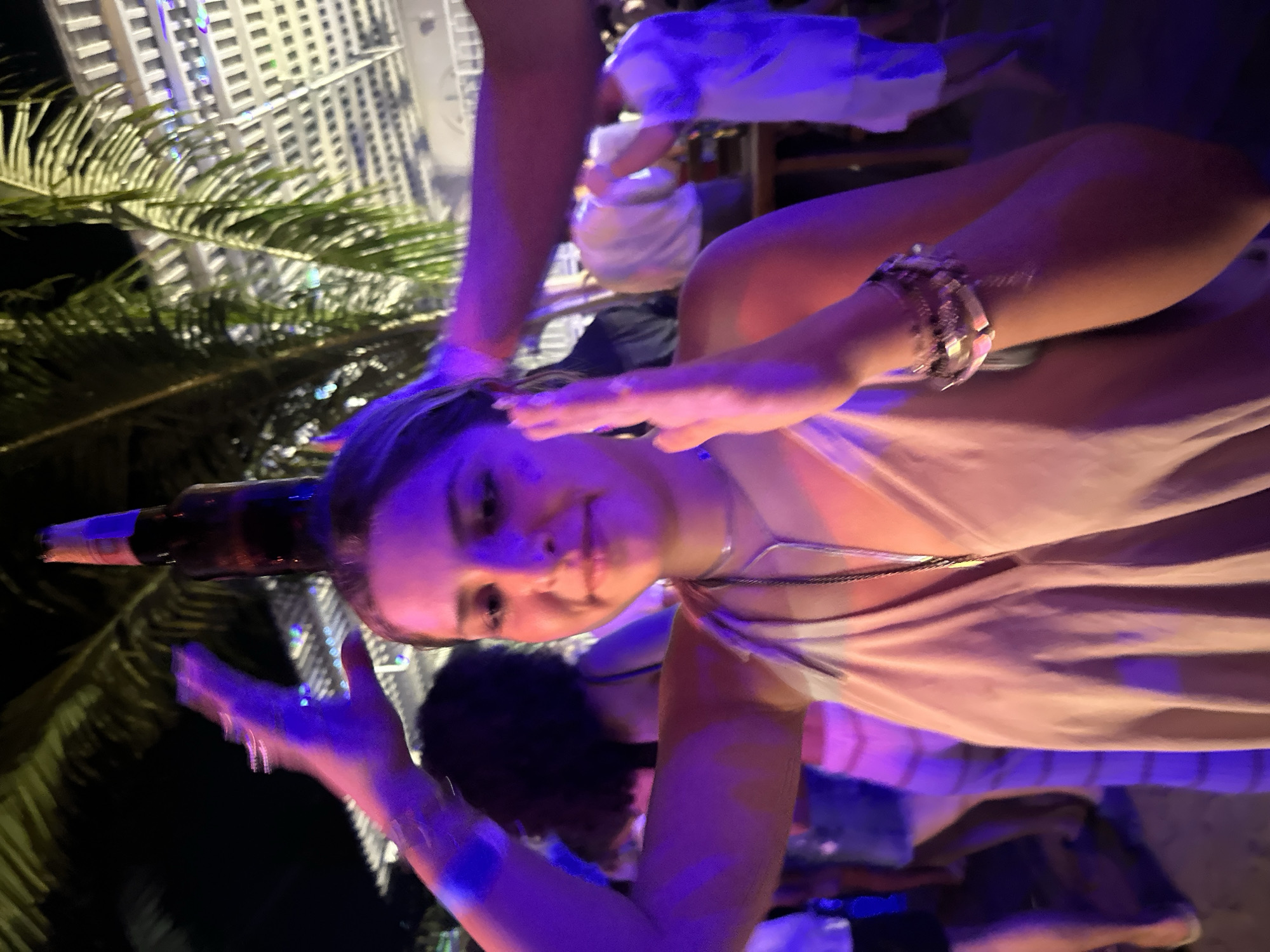 Women celebrate with drinks at Brisas de Zicatela venue