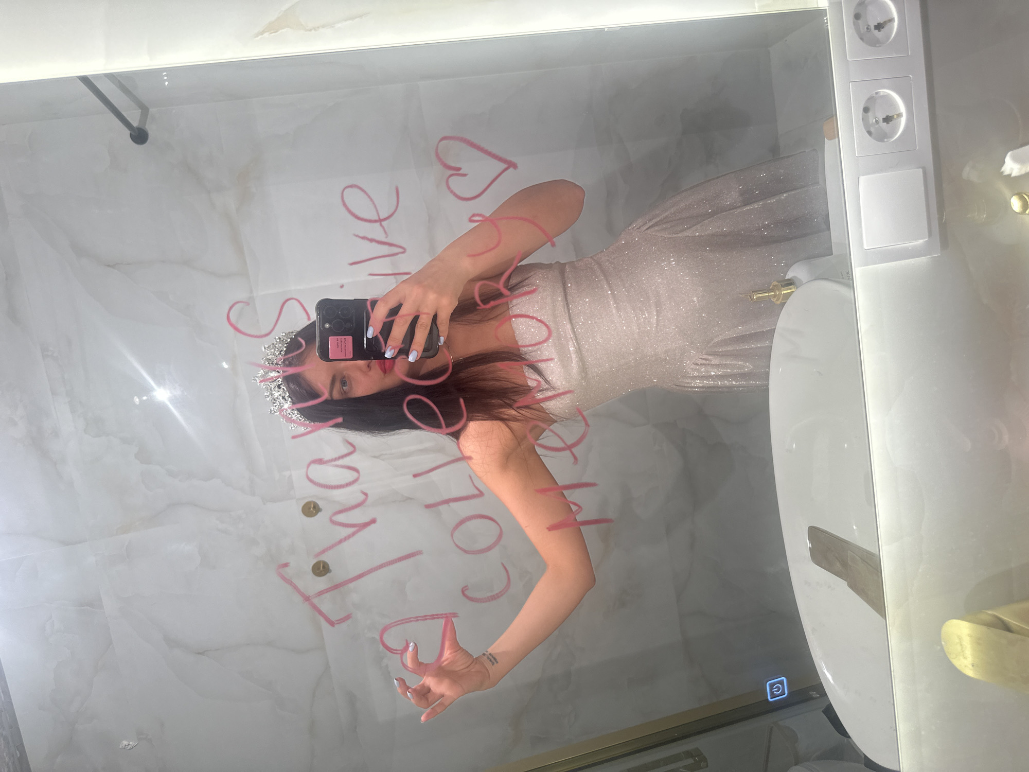 Woman takes mirror selfie in Moscow bathroom