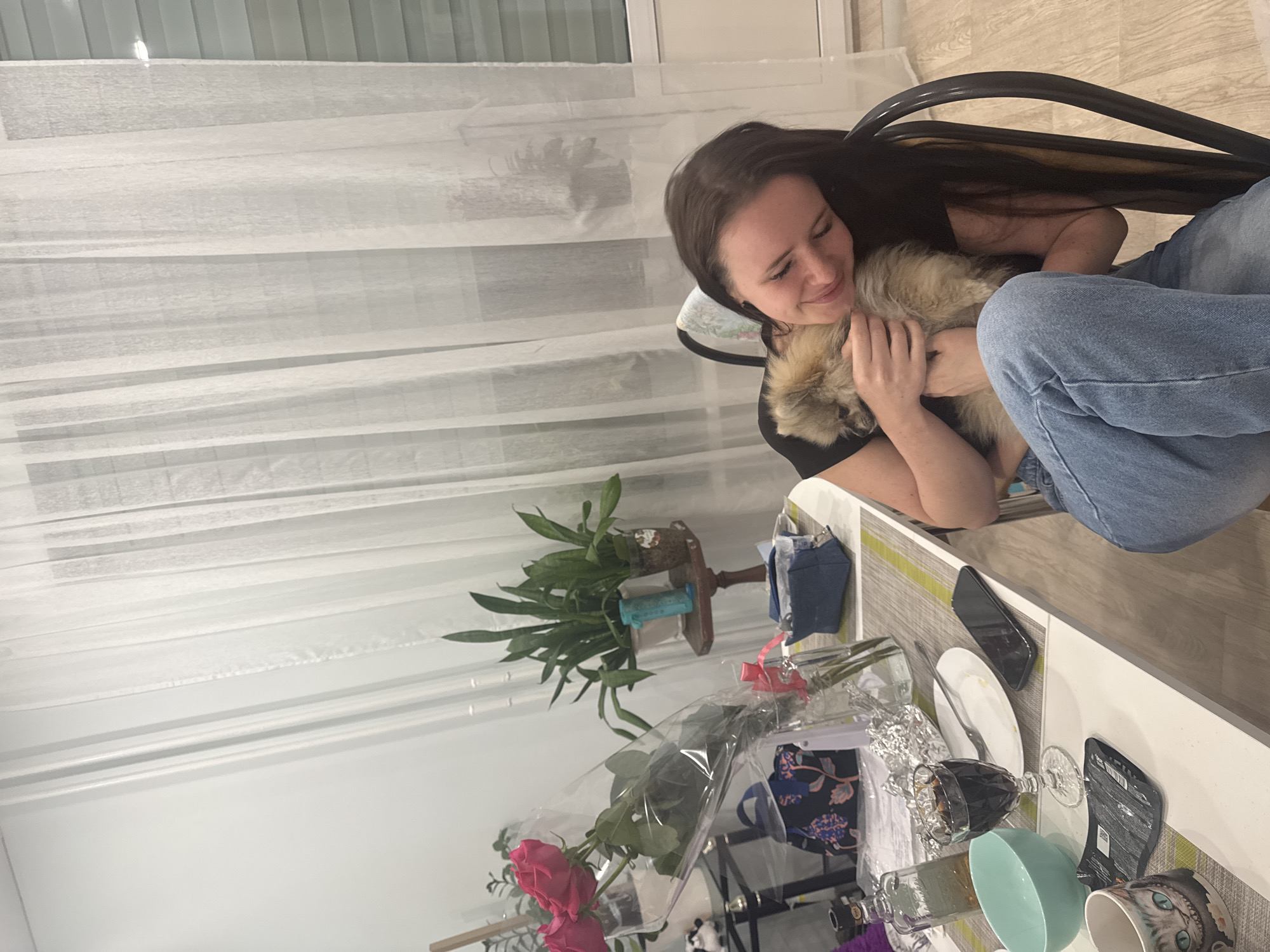 Woman plays with Pomeranian and Chihuahua at Sertolovo home