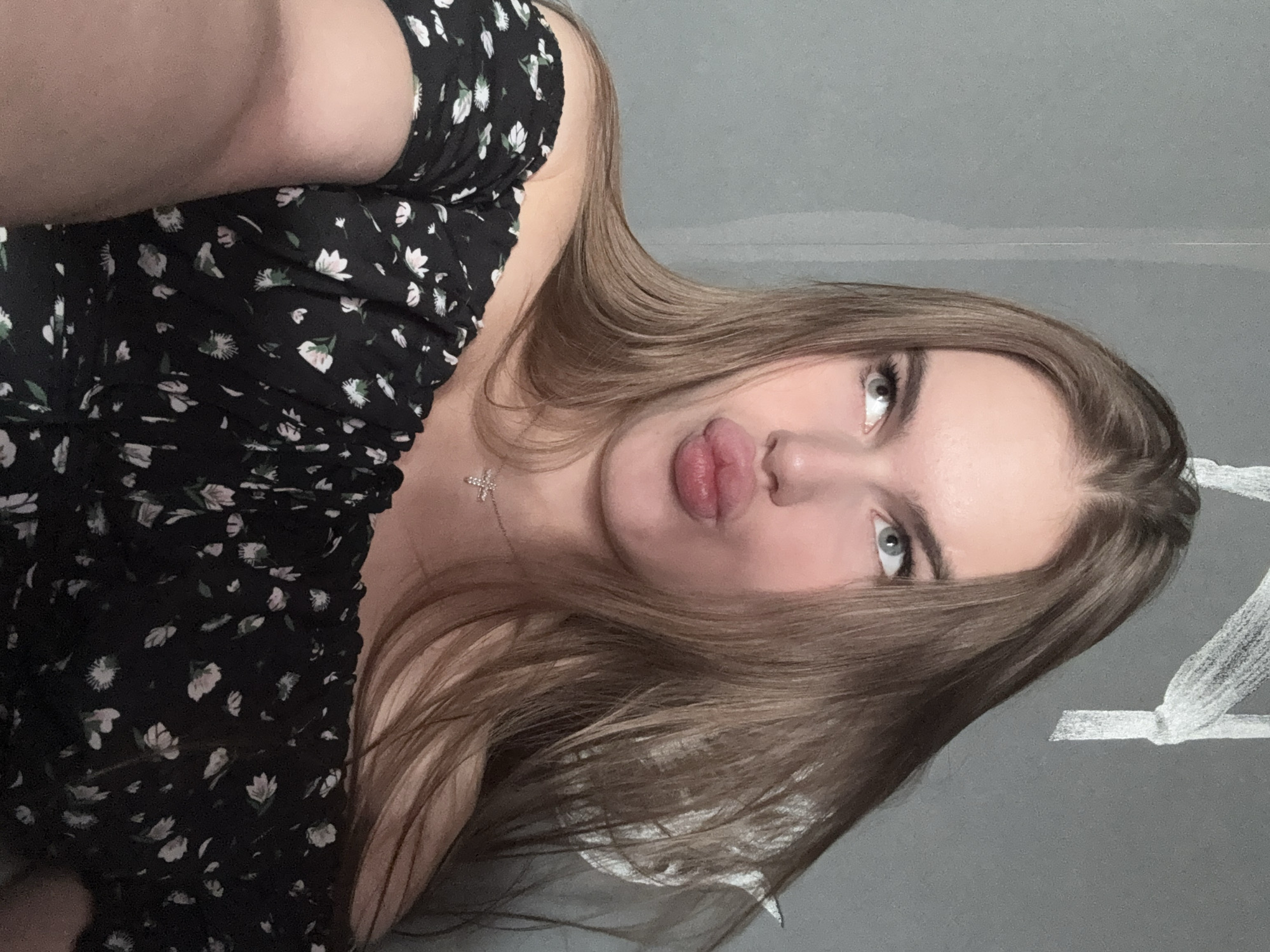 Quick selfie session in a Dnipro apartment, black floral dress