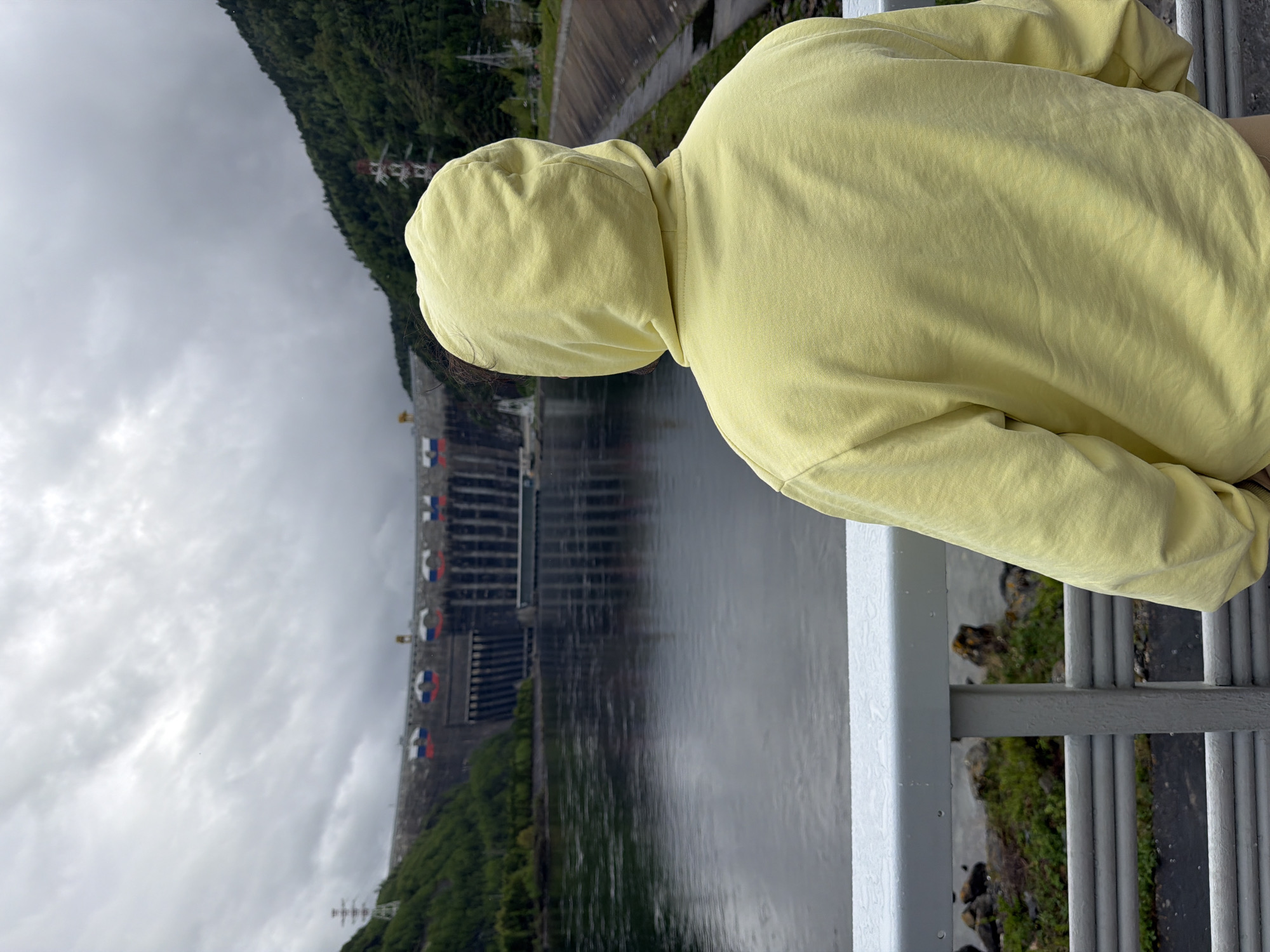 Visitor observes Sayano-Shushenskaya Dam from multiple viewpoints in Russia