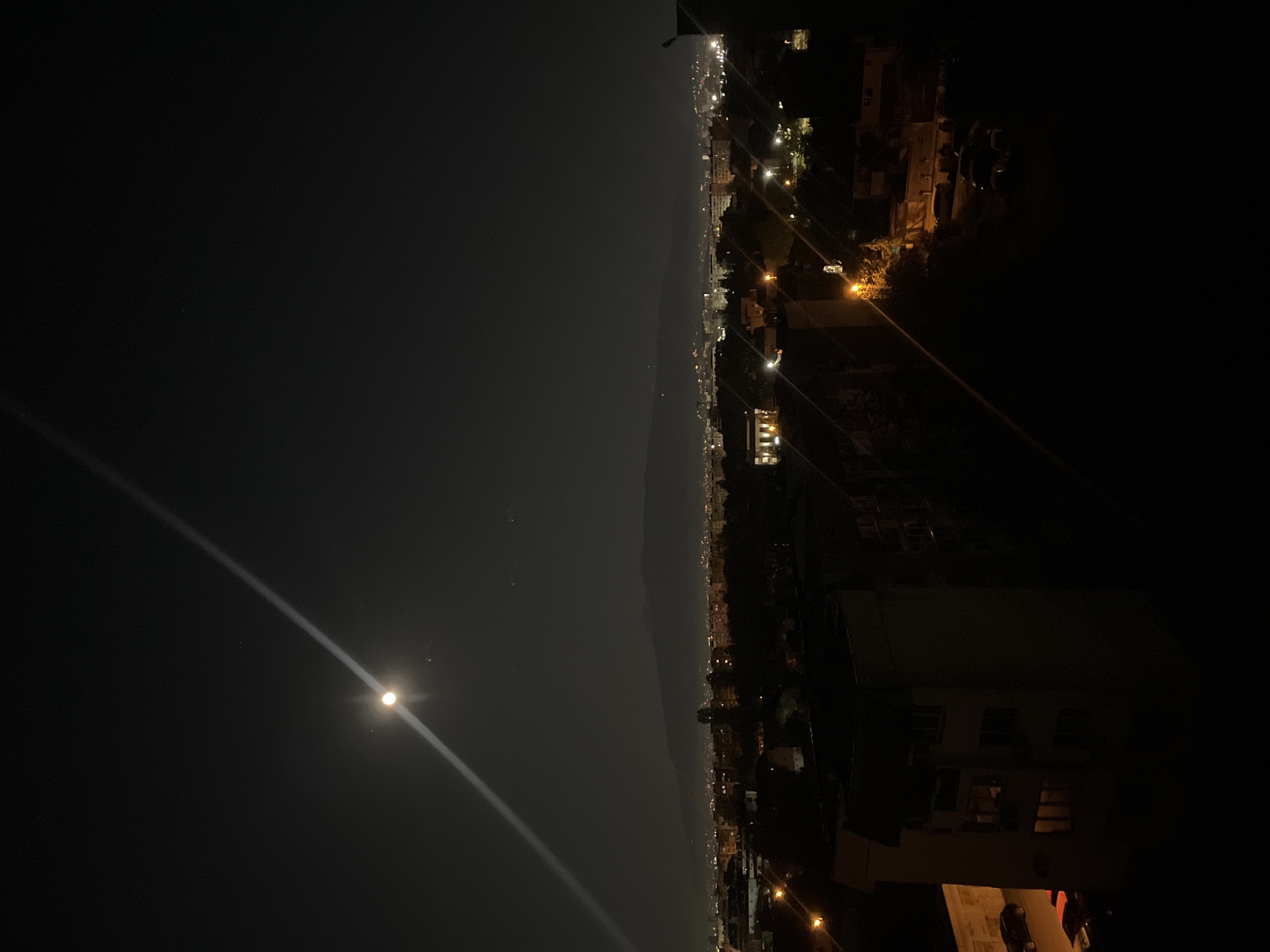 Sofia residents capture nighttime cityscape under moonlit sky