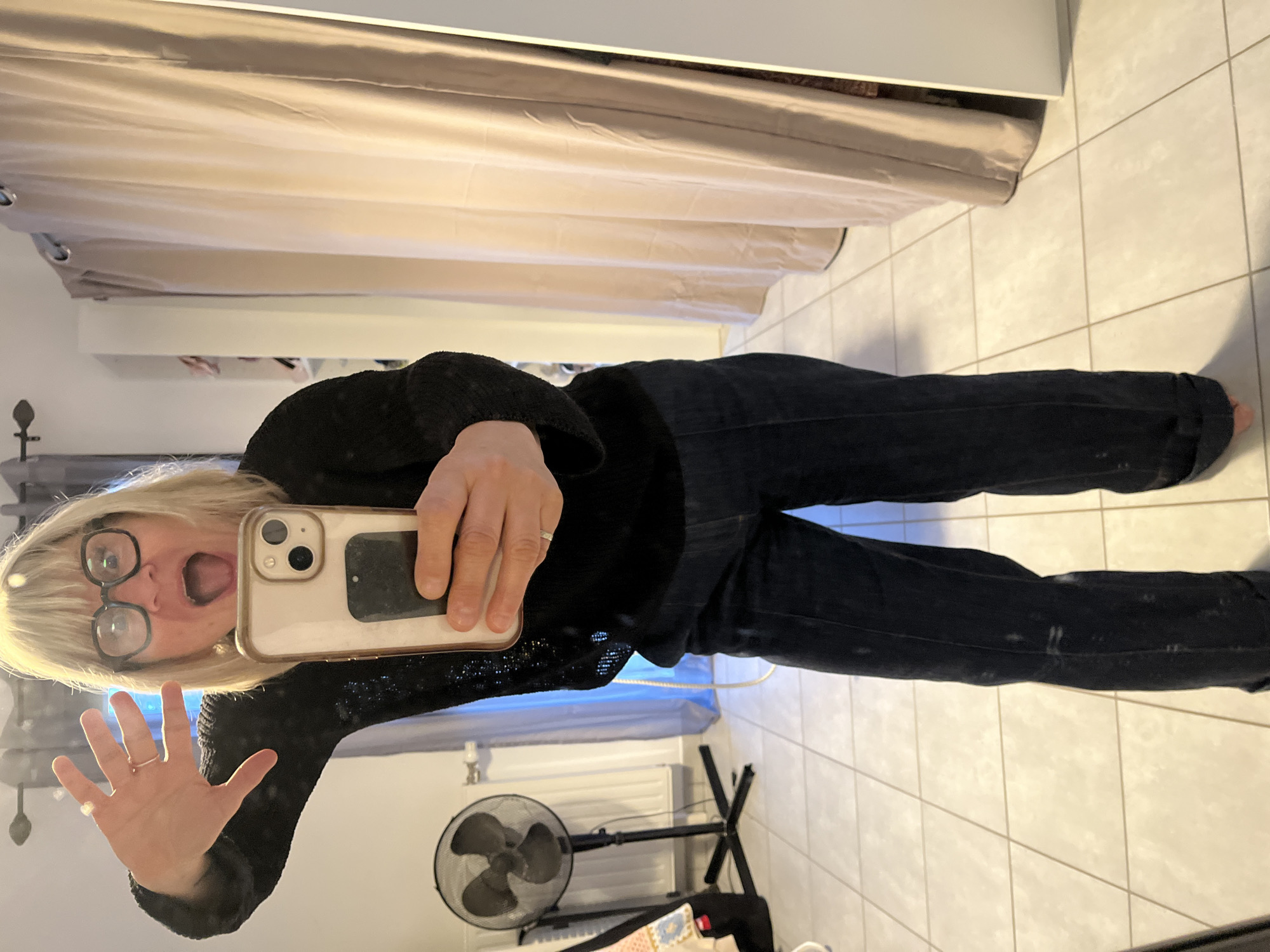 Woman takes mirror selfies in Chambœuf, France early morning