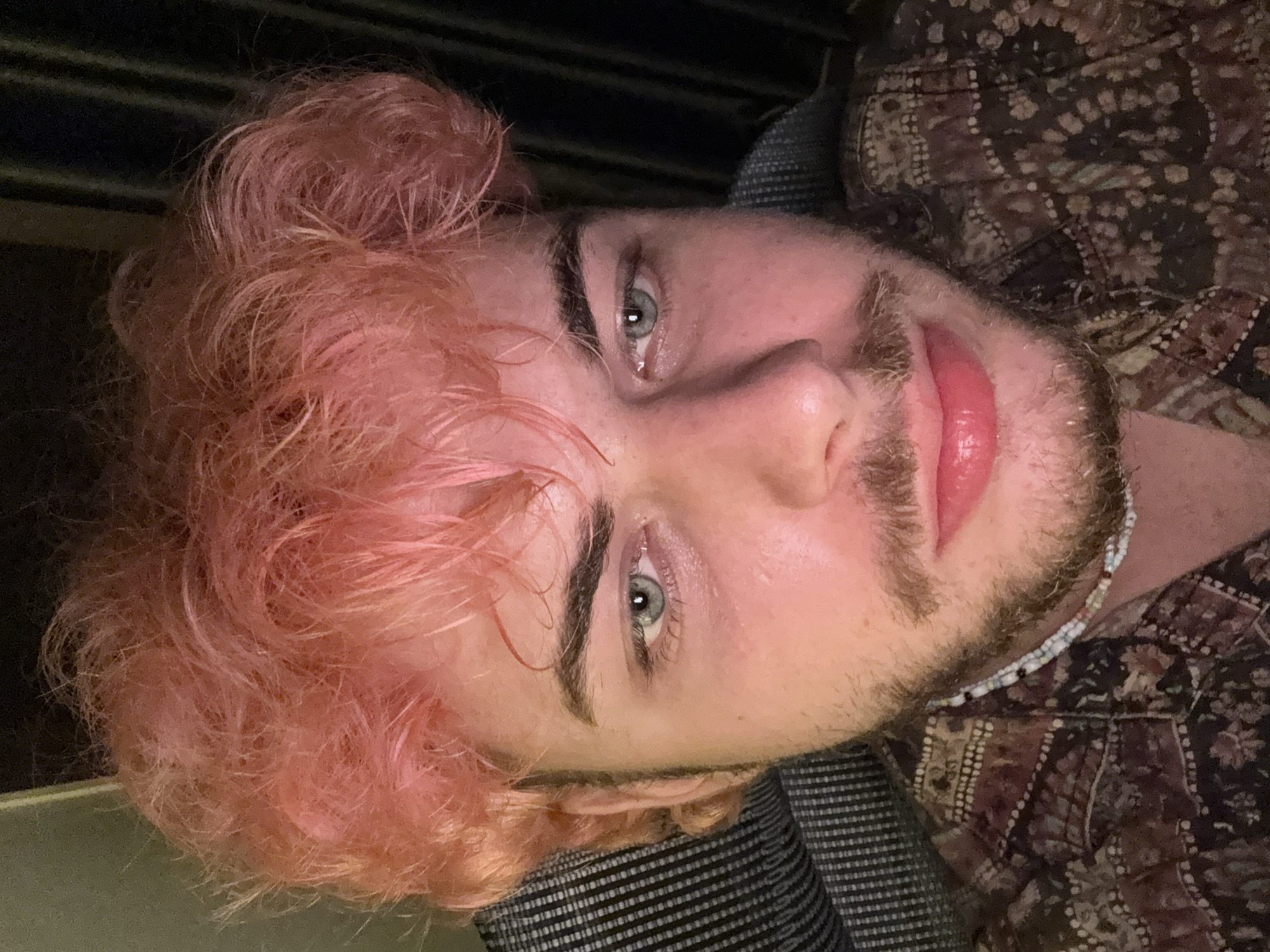 Pink-haired man documented in domestic setting, Đà Nẵng Vietnam