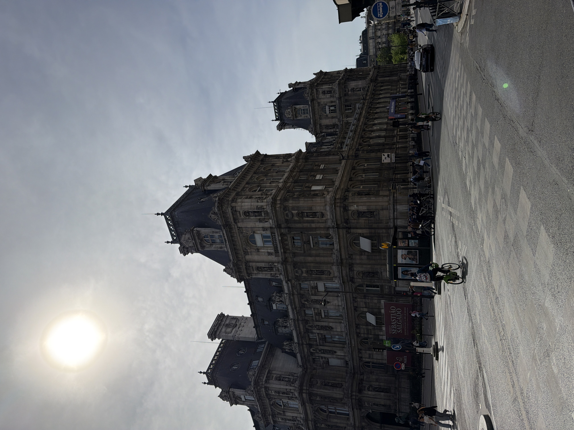 Historic Parisian building photographed under dramatic overcast afternoon sky