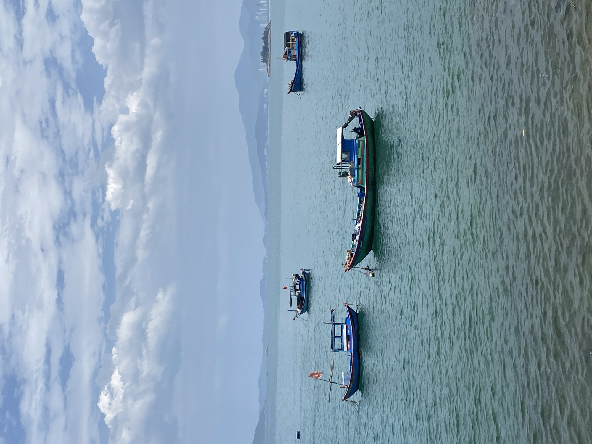 Nha Trang fishing harbor, boats at rest on a calm morning