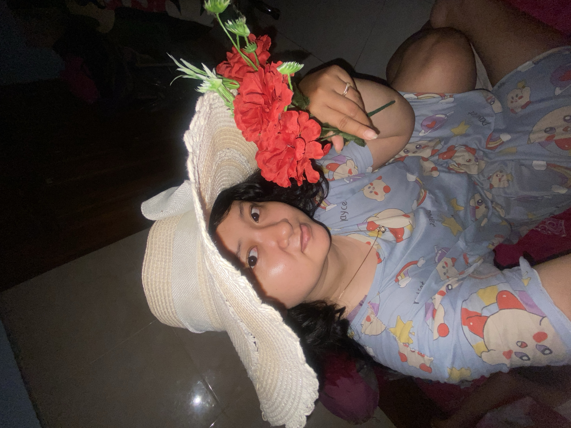 Woman resting in pajamas observed in Gelam, Indonesia