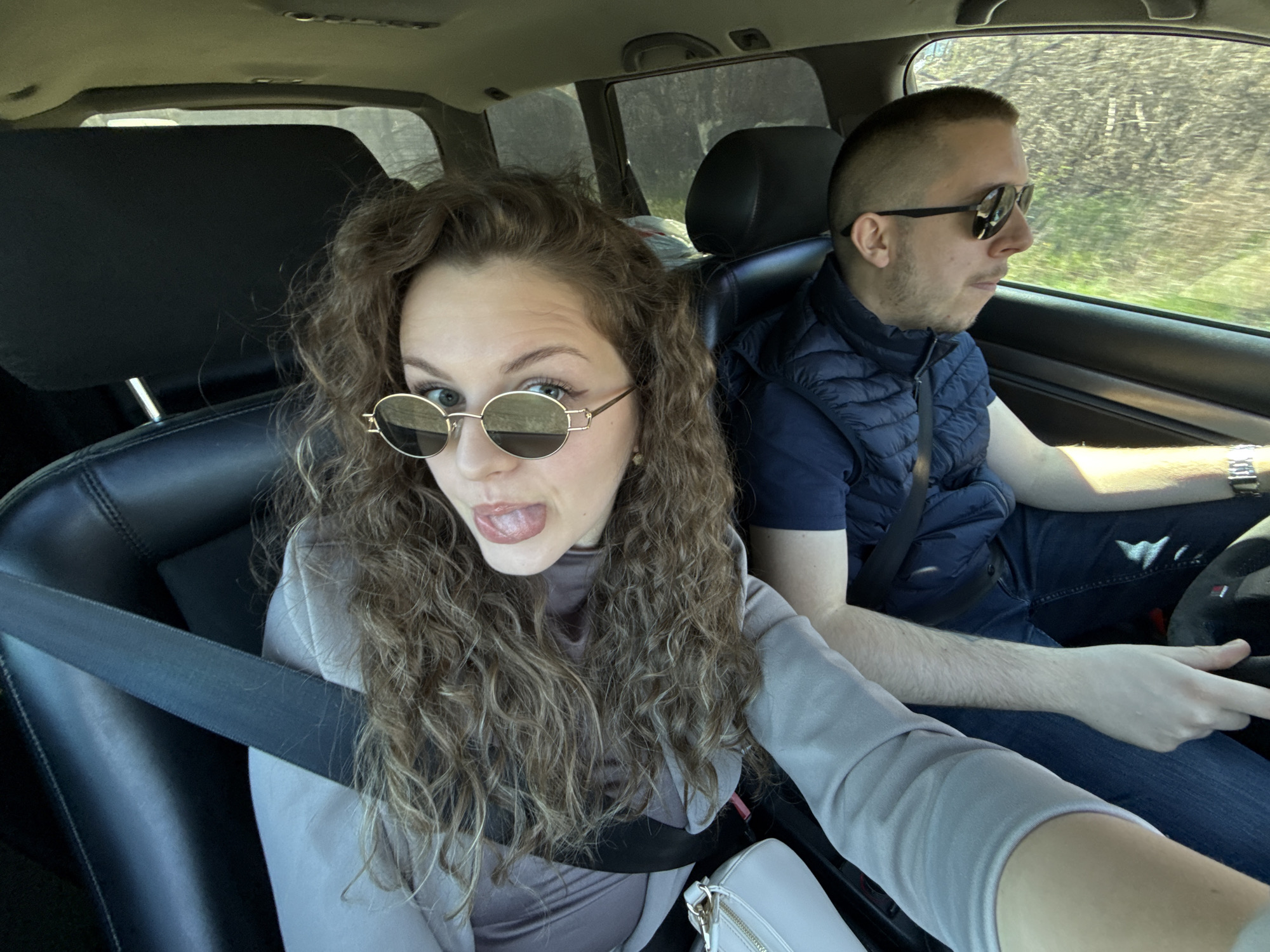 Couple spotted in playful moment while driving in Nikolaevo