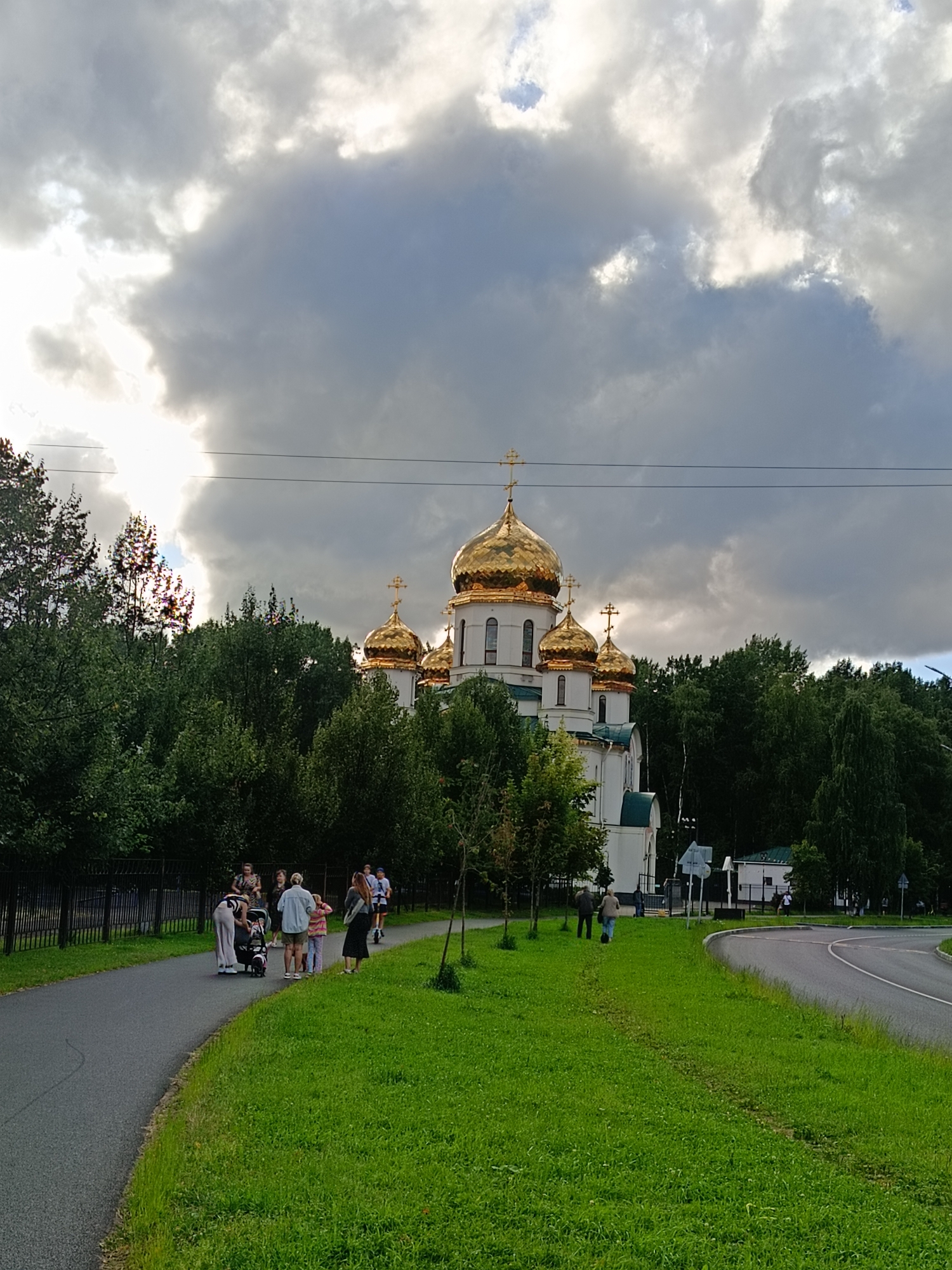Golden domes of a Saint Petersburg Orthodox church on a cloudy day
