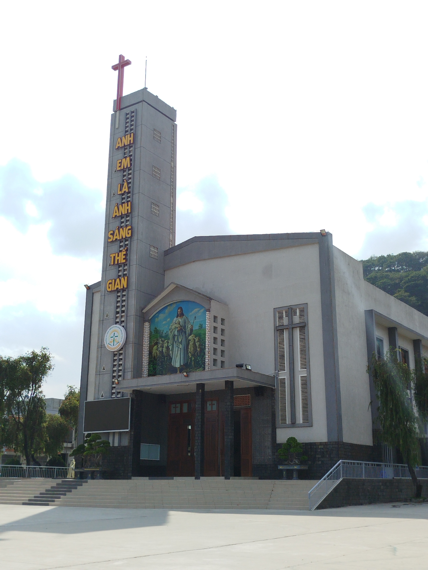 Modern Vietnamese church documented with exterior and decorated interior views