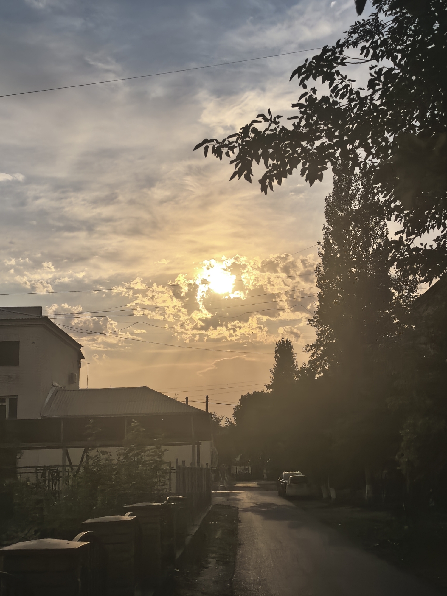 Dusk settles over a residential neighborhood in Fergana City