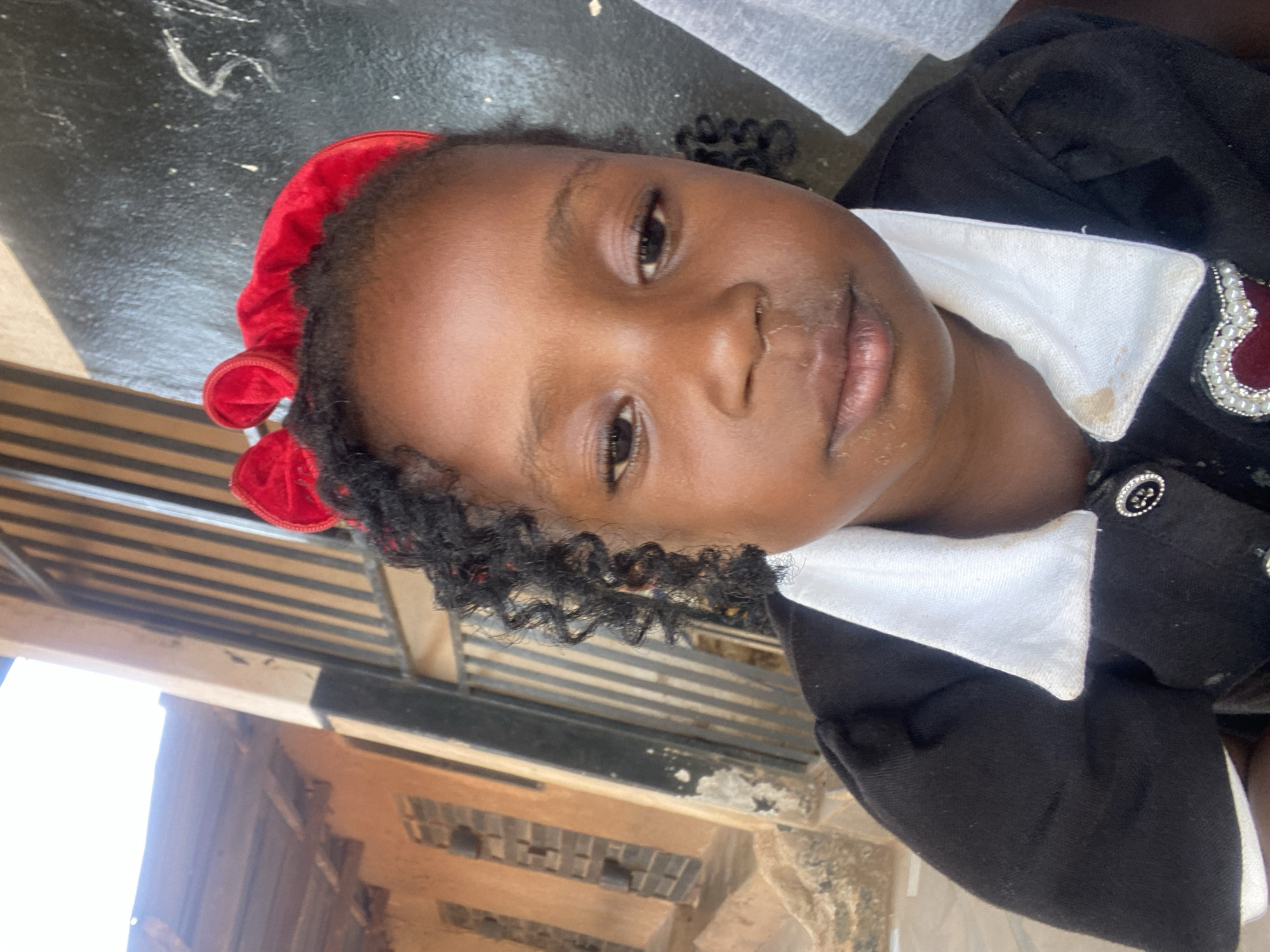 Young girl photographed in multiple poses in Kuru, Nigeria