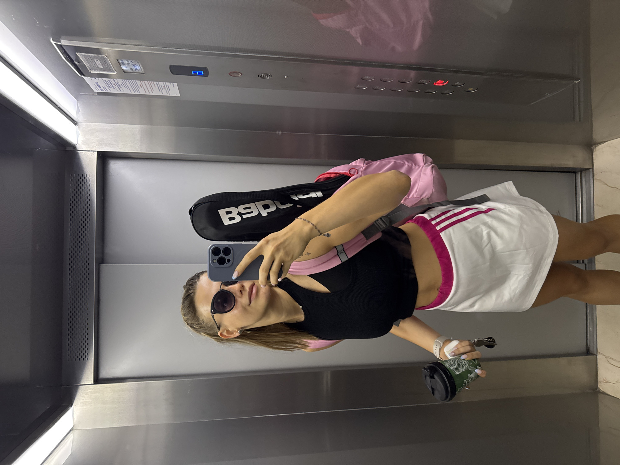 Elevator selfie moment in Sofia, stylish outfit in frame