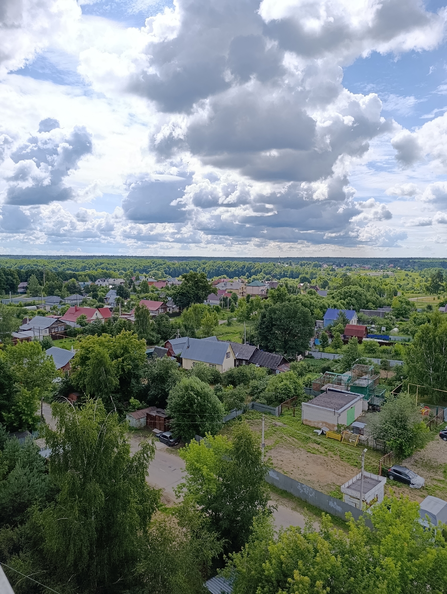 Stormy morning over Alexandrov's rooftops, forests, and home life