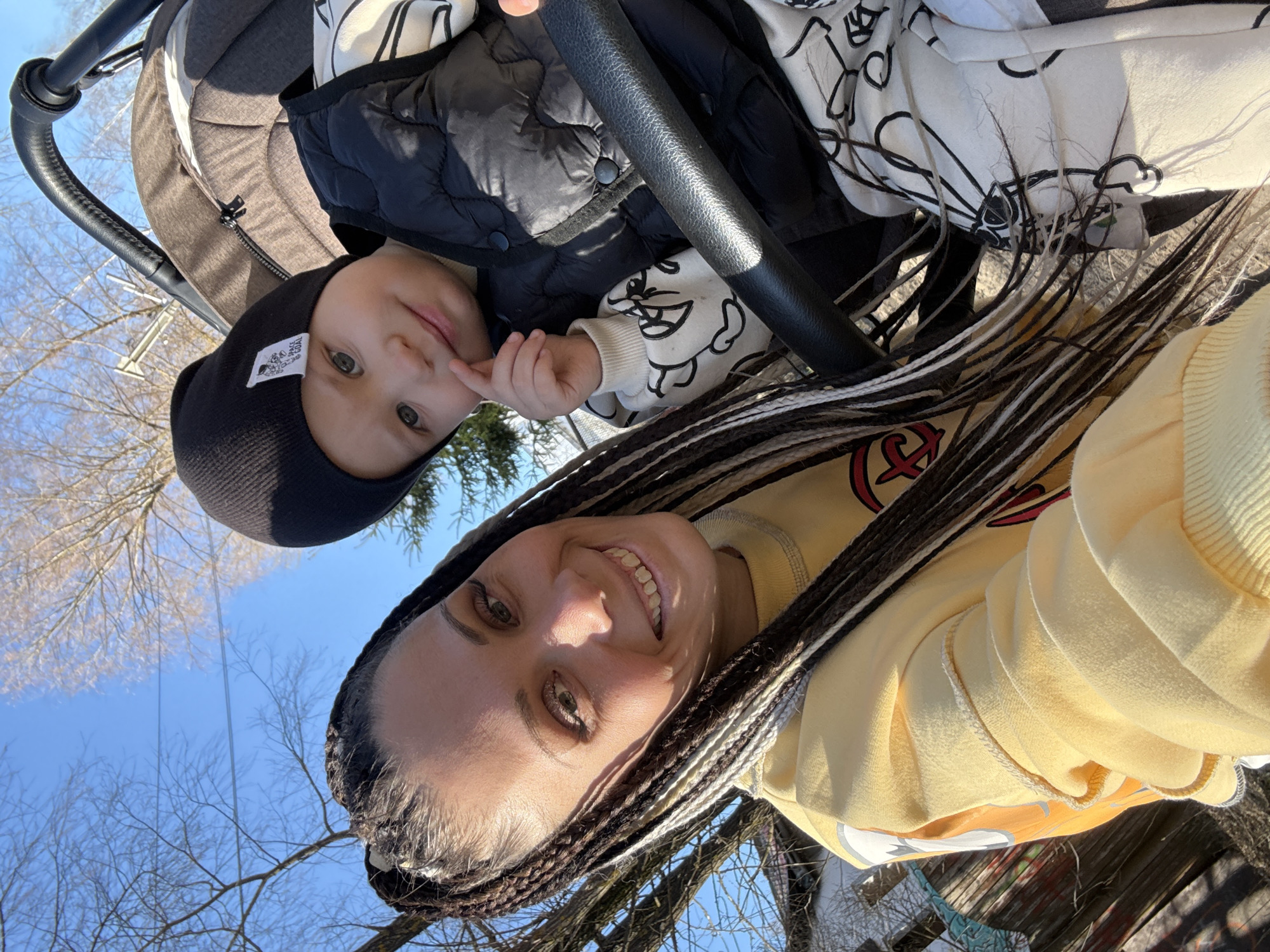 Woman takes selfies with baby during stroller outing