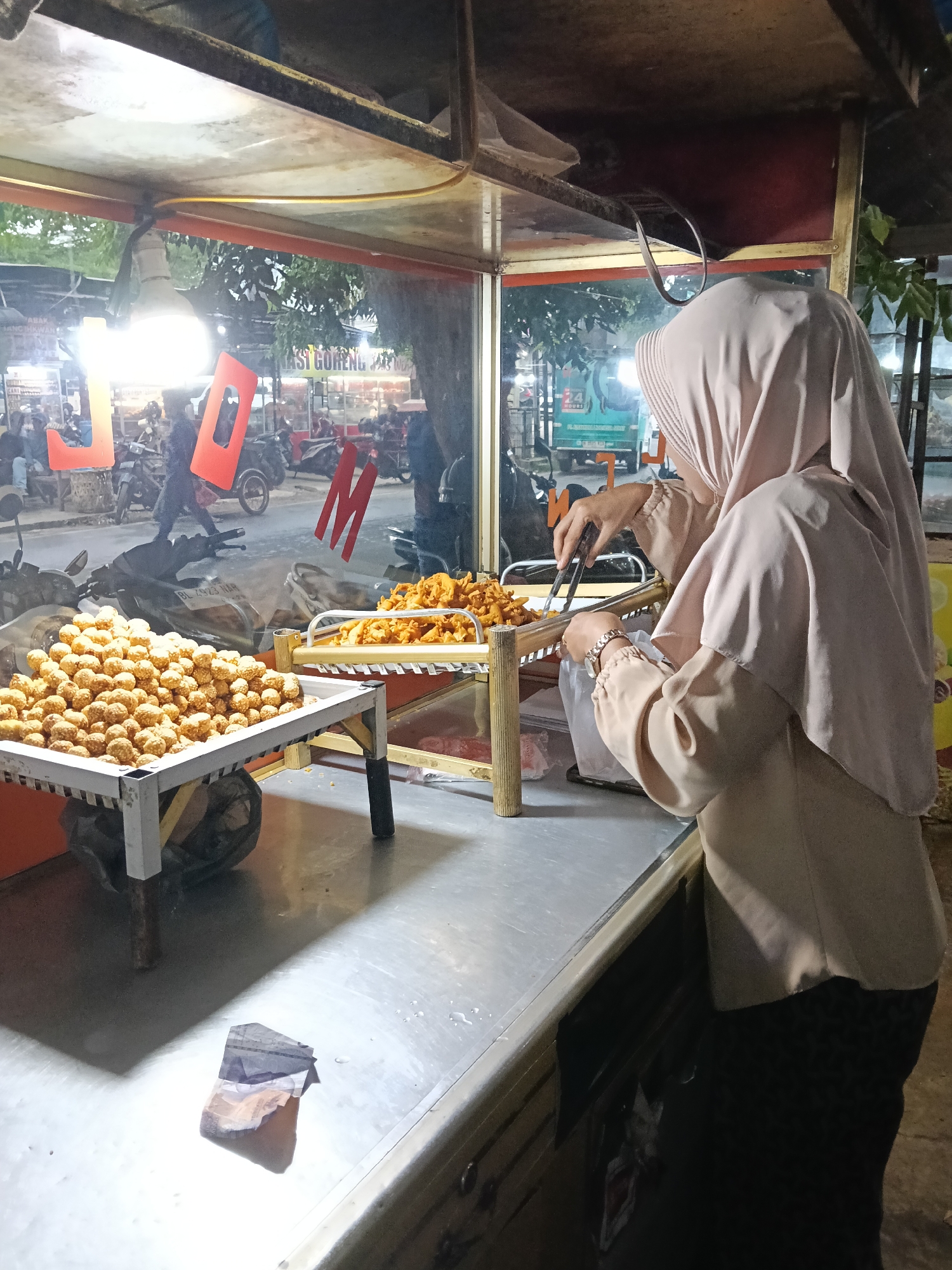 Daily life captured across Lhokseumawe streets and businesses