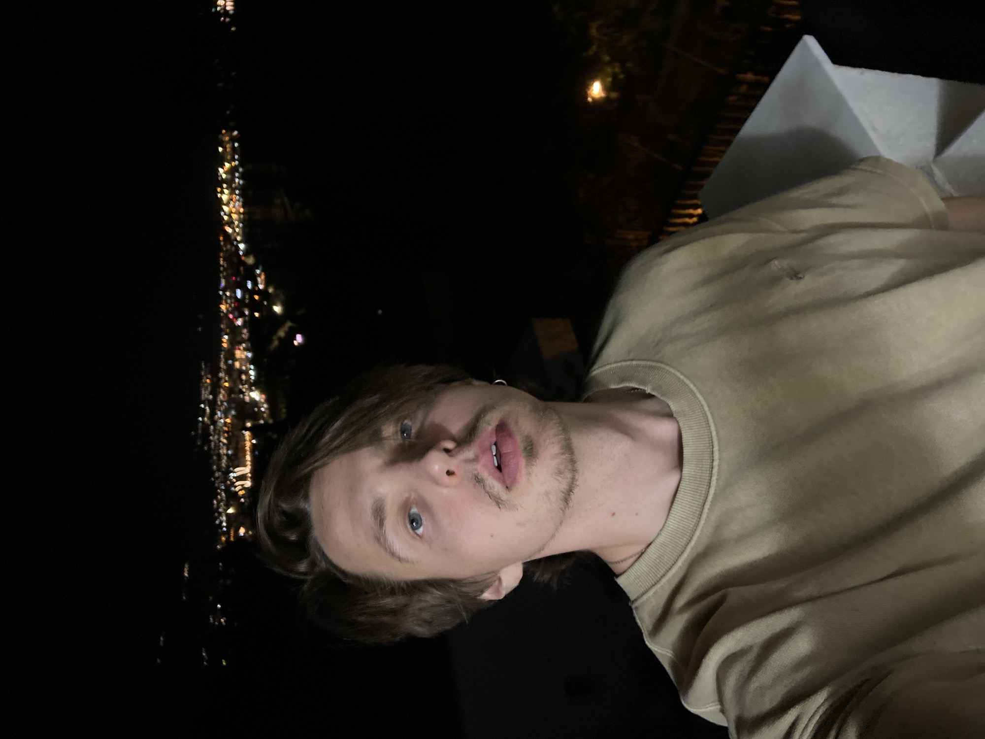 Man takes selfie in Šušanj, Montenegro evening setting