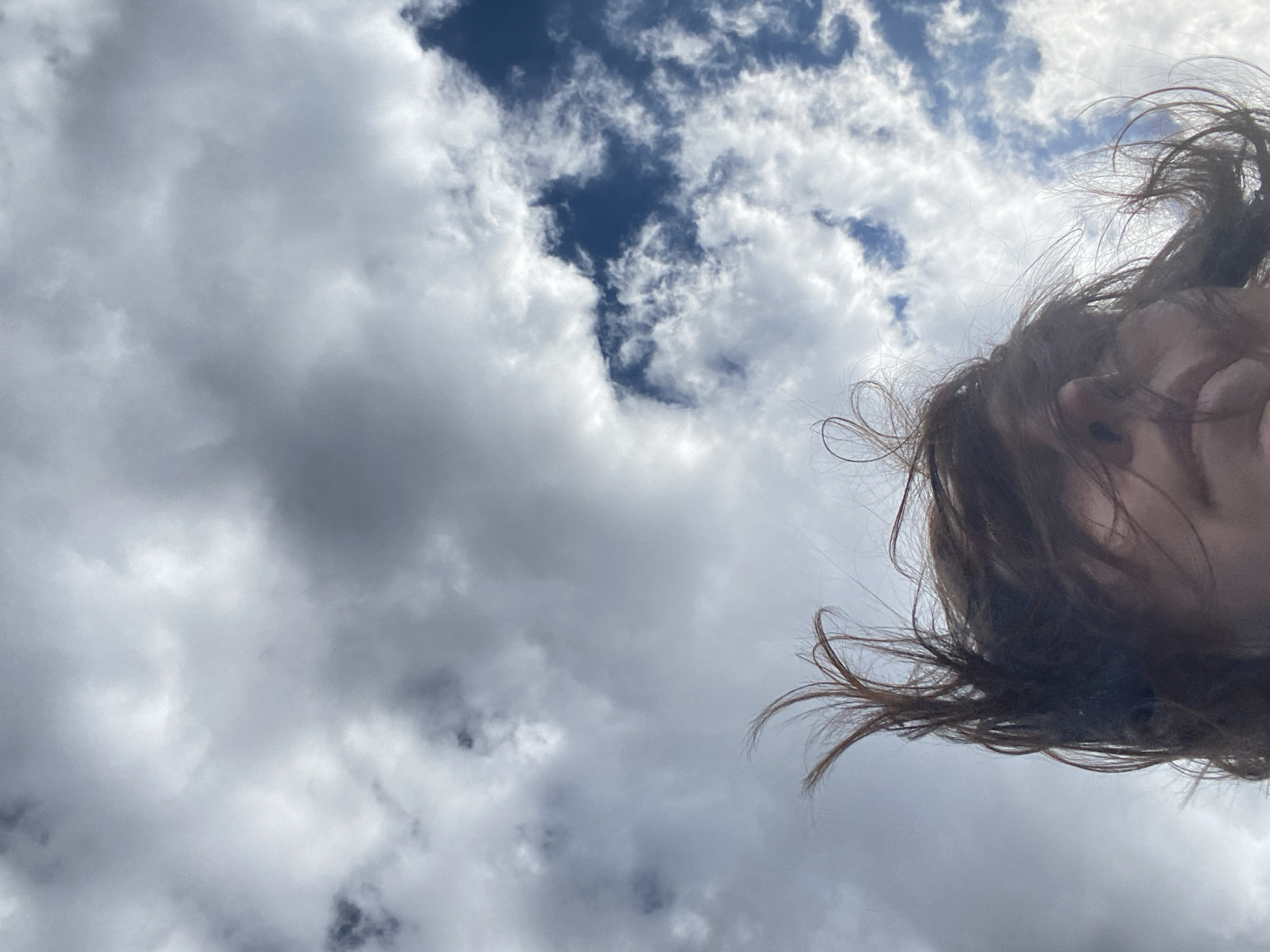Person photographed against cloudy sky in Nizhnie Yaki, Russia