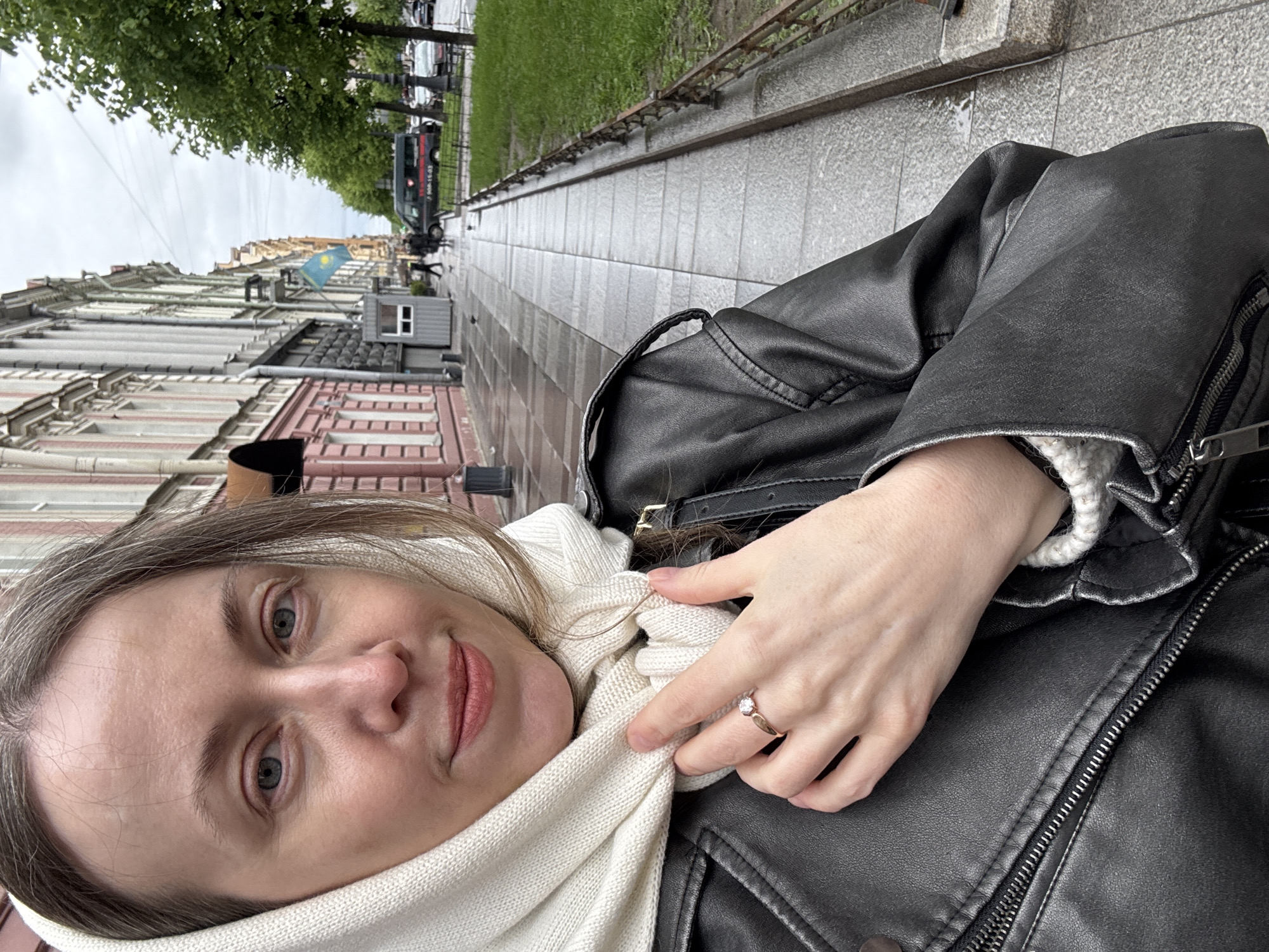 Woman takes selfie on historic Saint Petersburg street