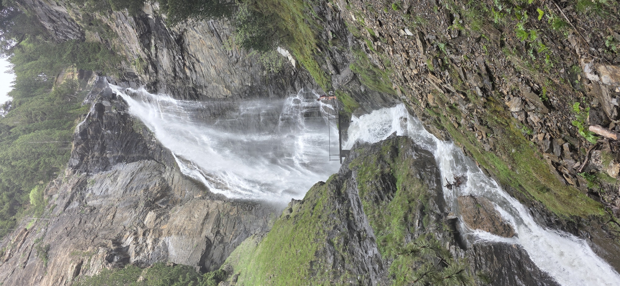 Visitors document waterfalls and bridges in Benasque Spain