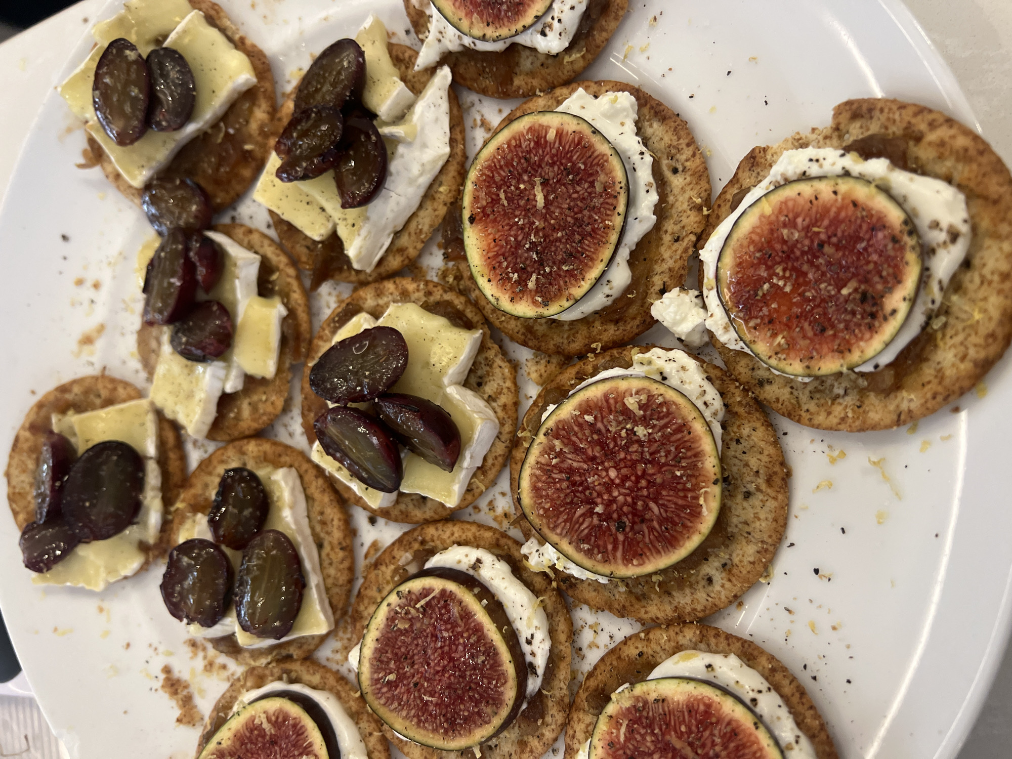 Man enjoys cheese and fruit platter in London building