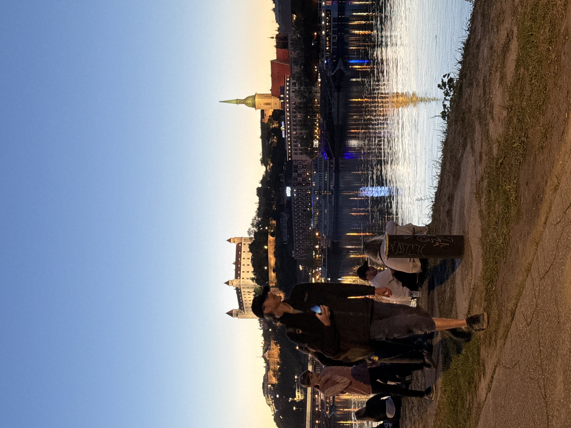Evening riverside gathering with stage, beer tent in Bratislava