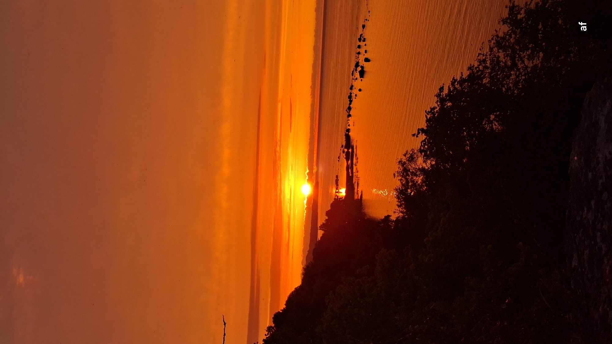 Baltic sunset burns orange over the Tabasalu coastline