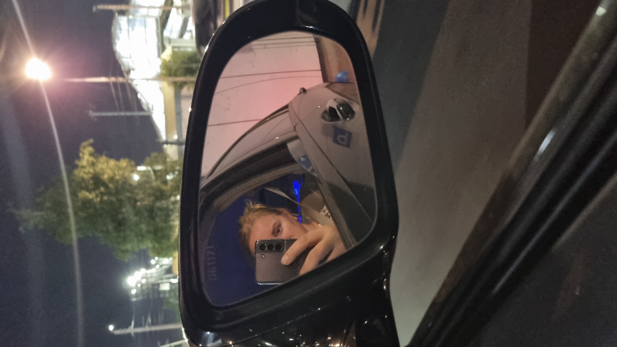 Late-night side mirror selfie in Reutov, Russia