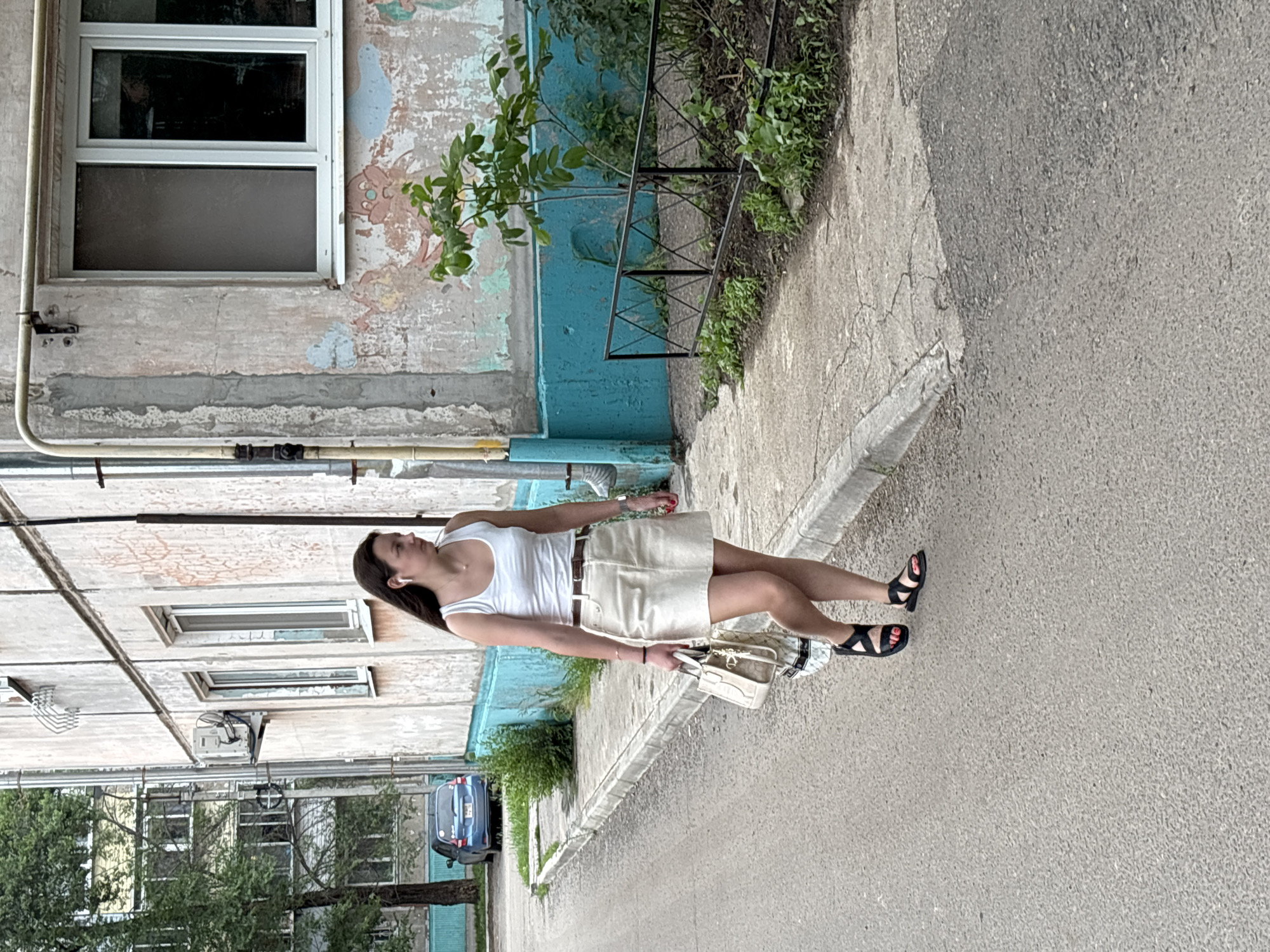 Quiet morning street activity in a Blagoveshchensk residential neighborhood