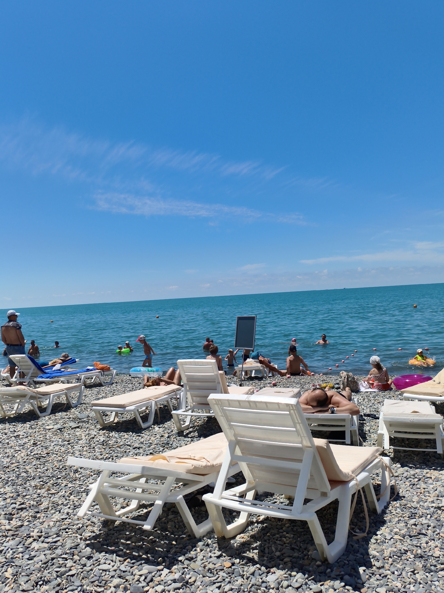 Tourists enjoy sunny beach day in Sochi, Russia