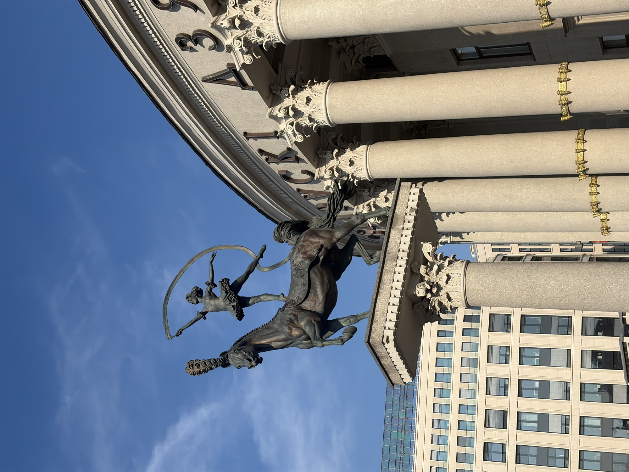 Bronze circus sculptures and classic architecture in central Minsk