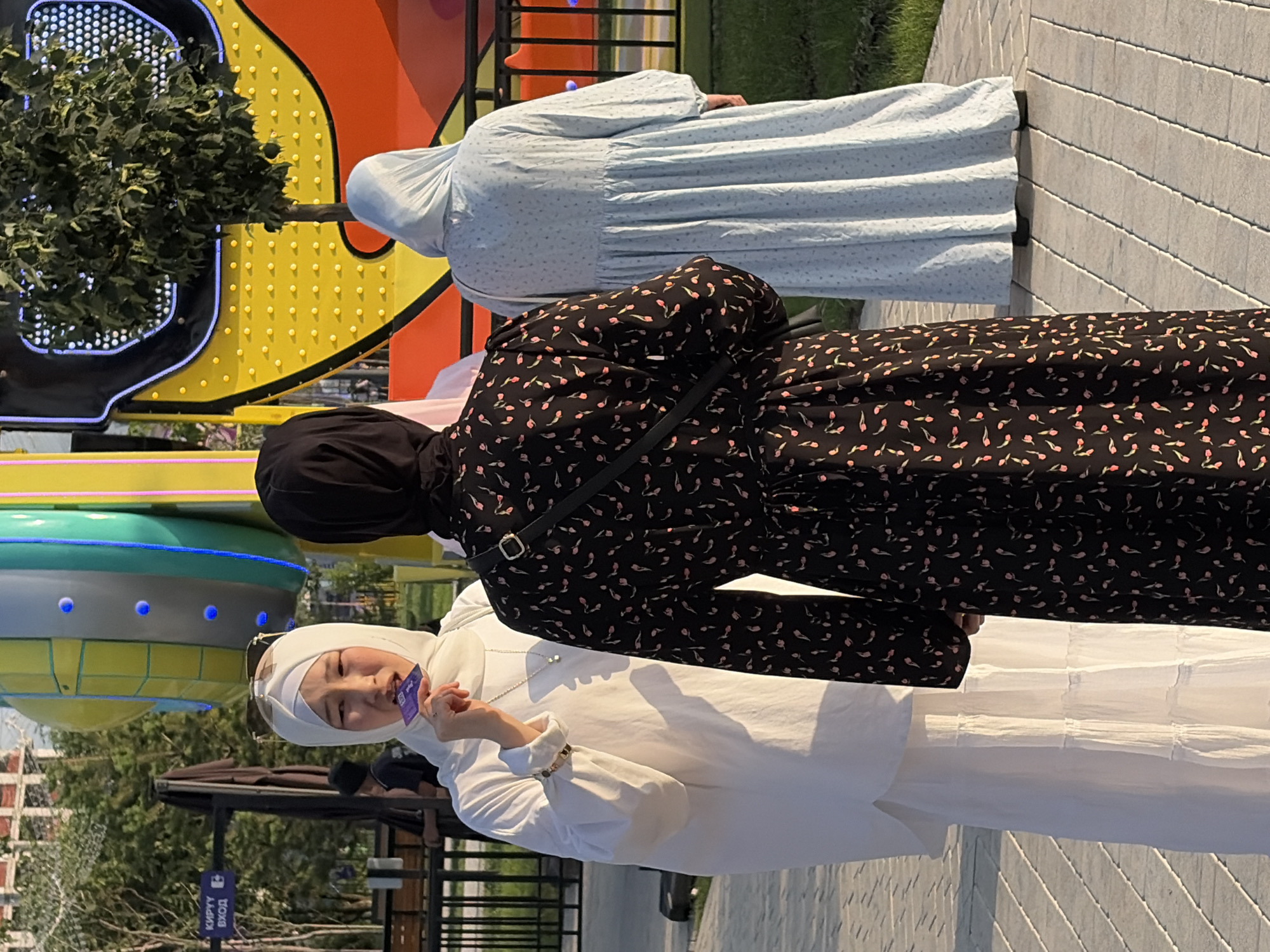 Park visitors enjoy casual afternoon at amusement area