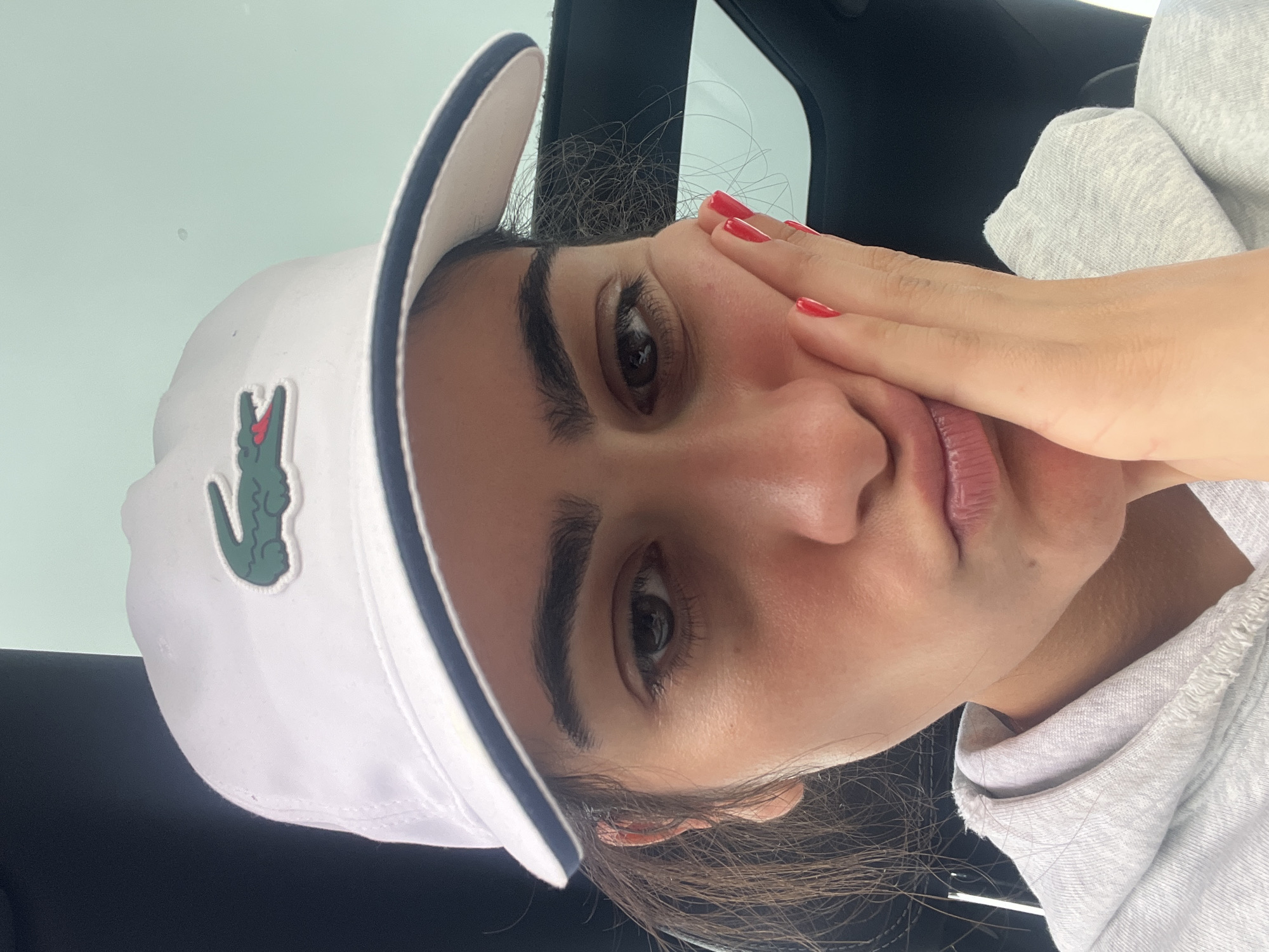 Car selfies in Porto, Lacoste cap front and center
