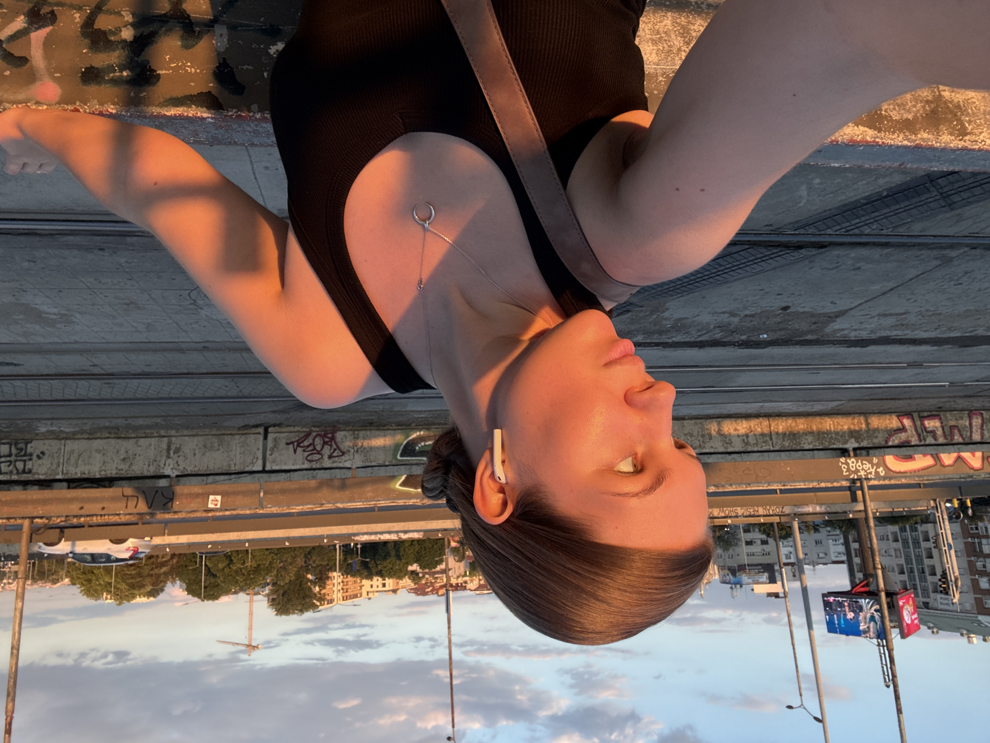 Sunset selfies on a graffiti-tagged bridge in Vozdovac, Belgrade