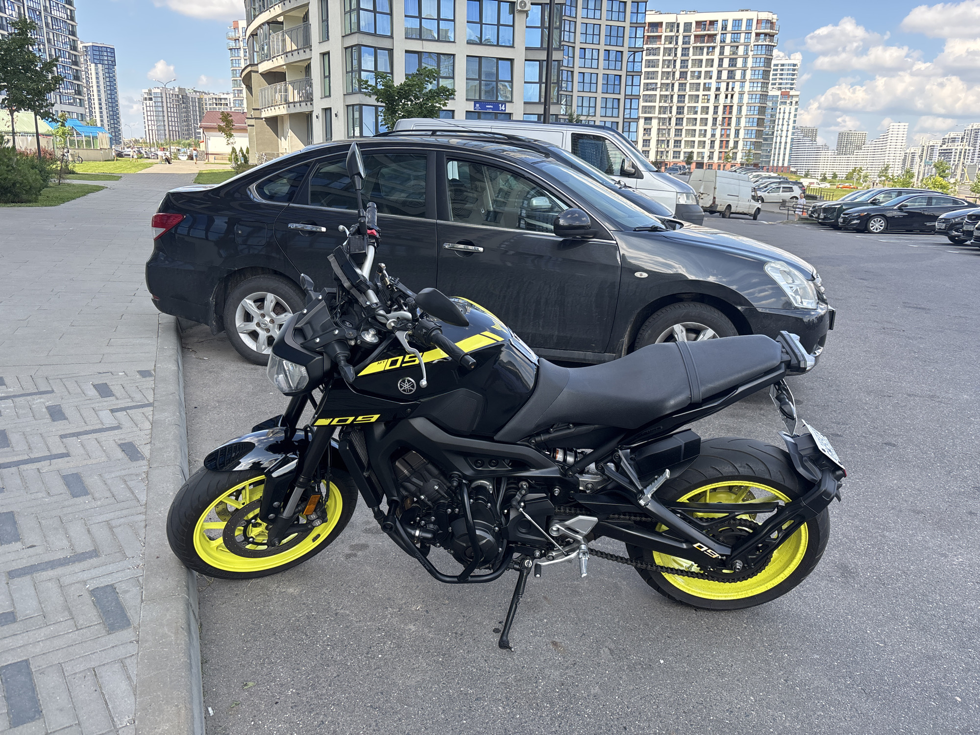 Modern residential complex in Minsk, motorcycle parked out front