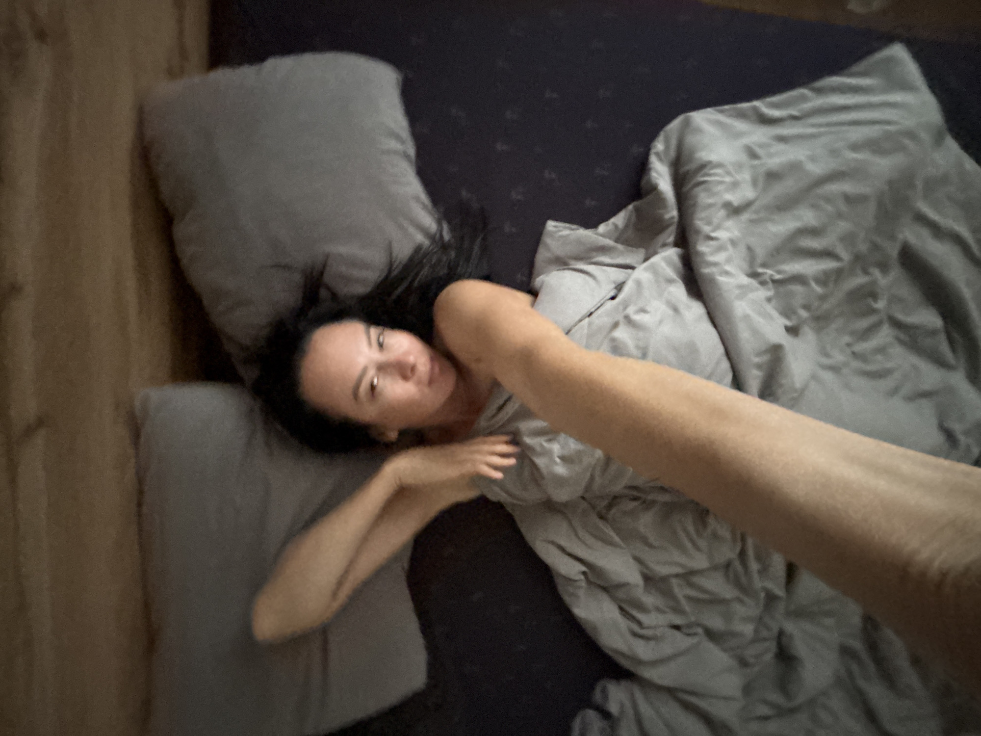 Woman takes morning selfies with dog in Chaikovsky bedroom