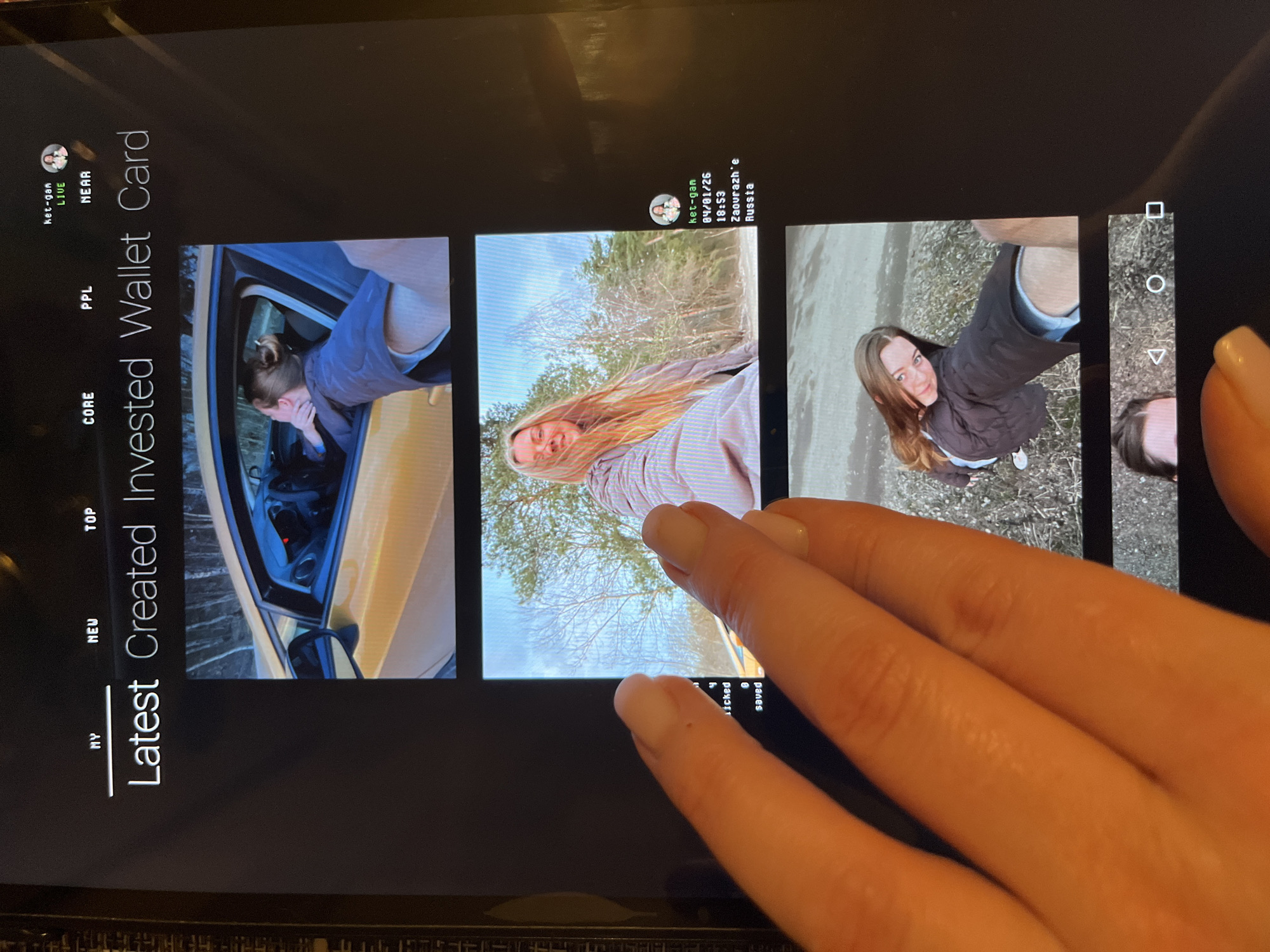 Person views social media feed on tablet in Russia